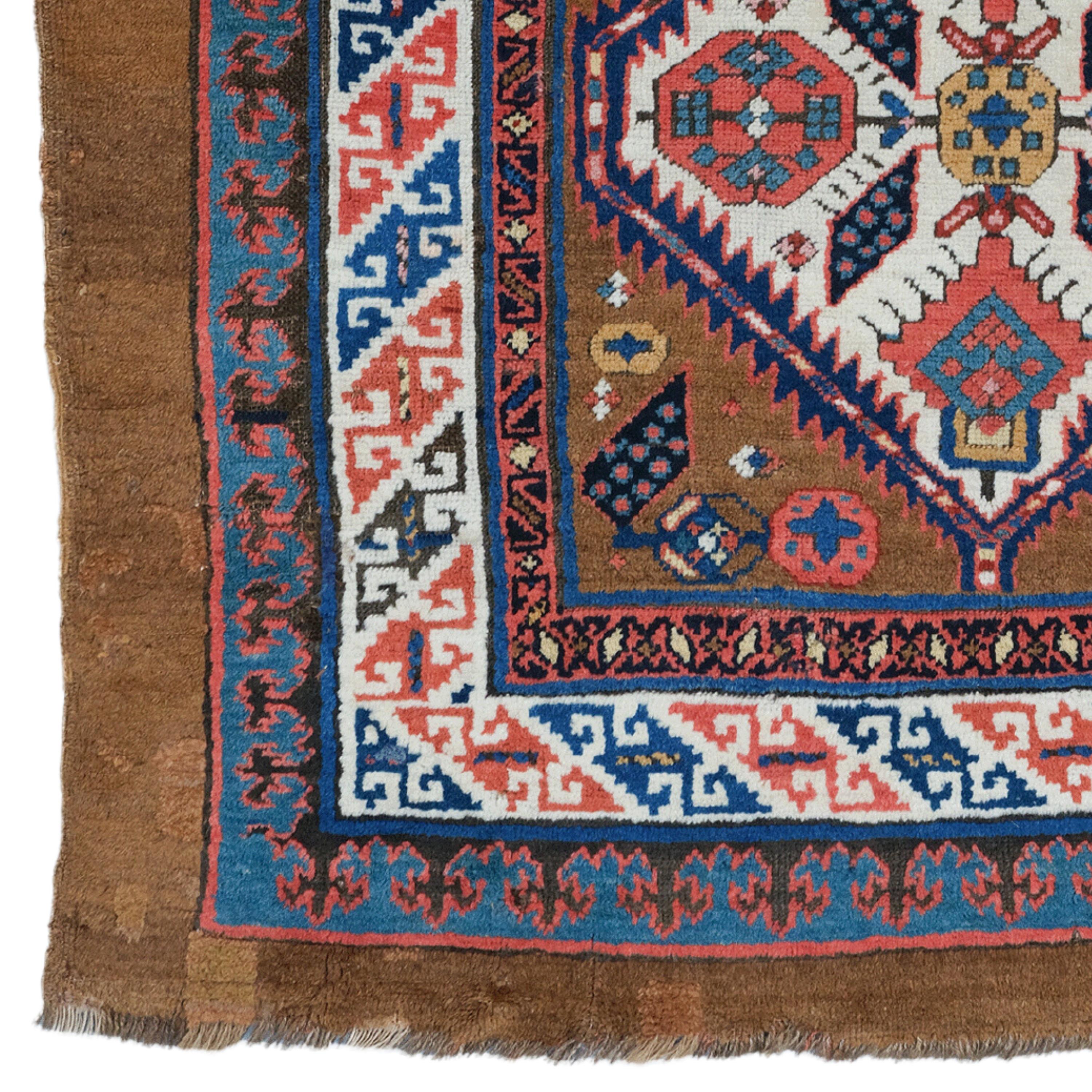 This elegant 19th-century Sarab carpet is an example of the most exquisite craftsmanship of its period. It adds nobility to any space with its rich history and sophisticated design. Vibrant red and golden motifs embroidered on a dark blue background
