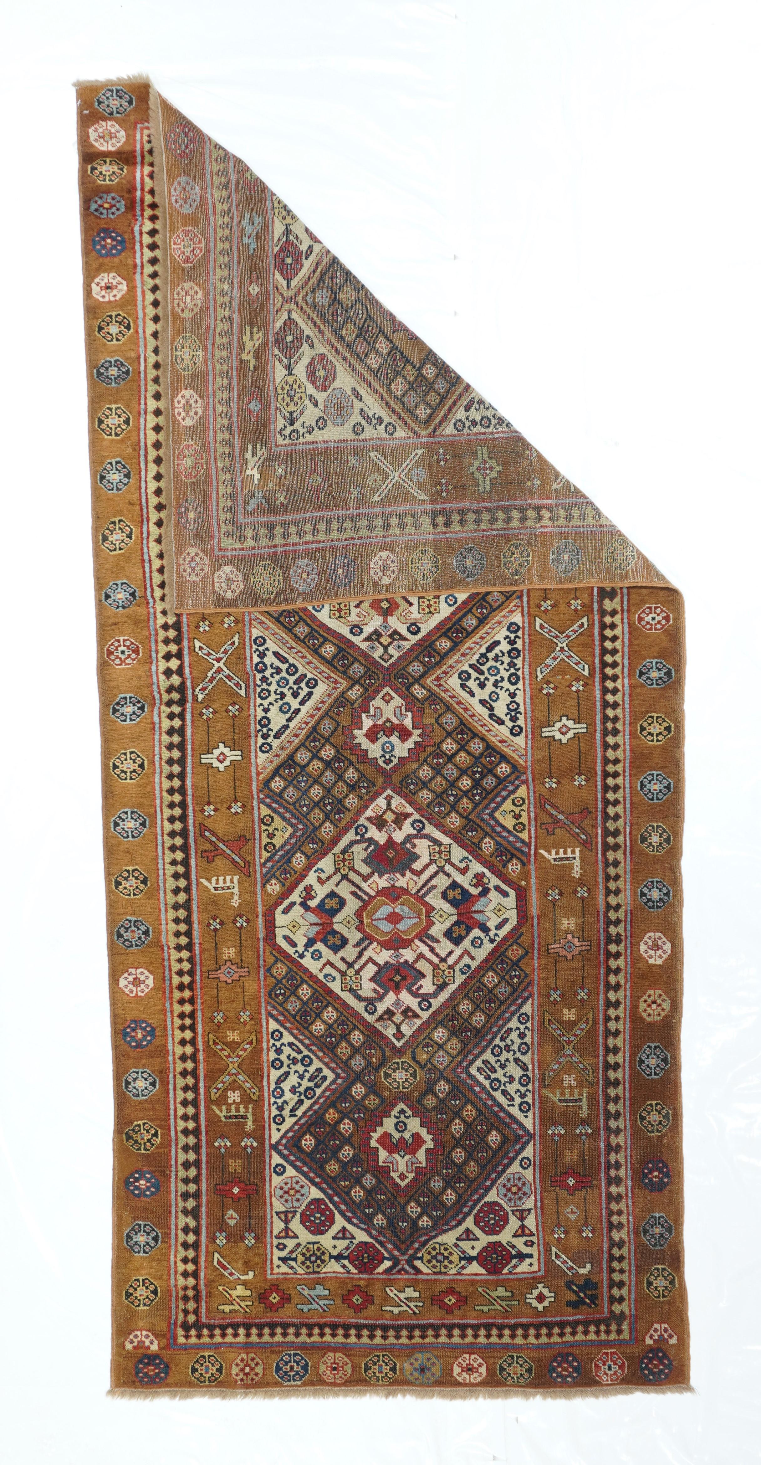Antique Sarab Rug 3'7'' x 8'. A study in camel tones, ecru and darkest brown, with two hexagonal cream medallions surrounded with tiny diamonds enclosing tinier flowers; ecru triangular corners with diminutive cloud bands. Camel border with large