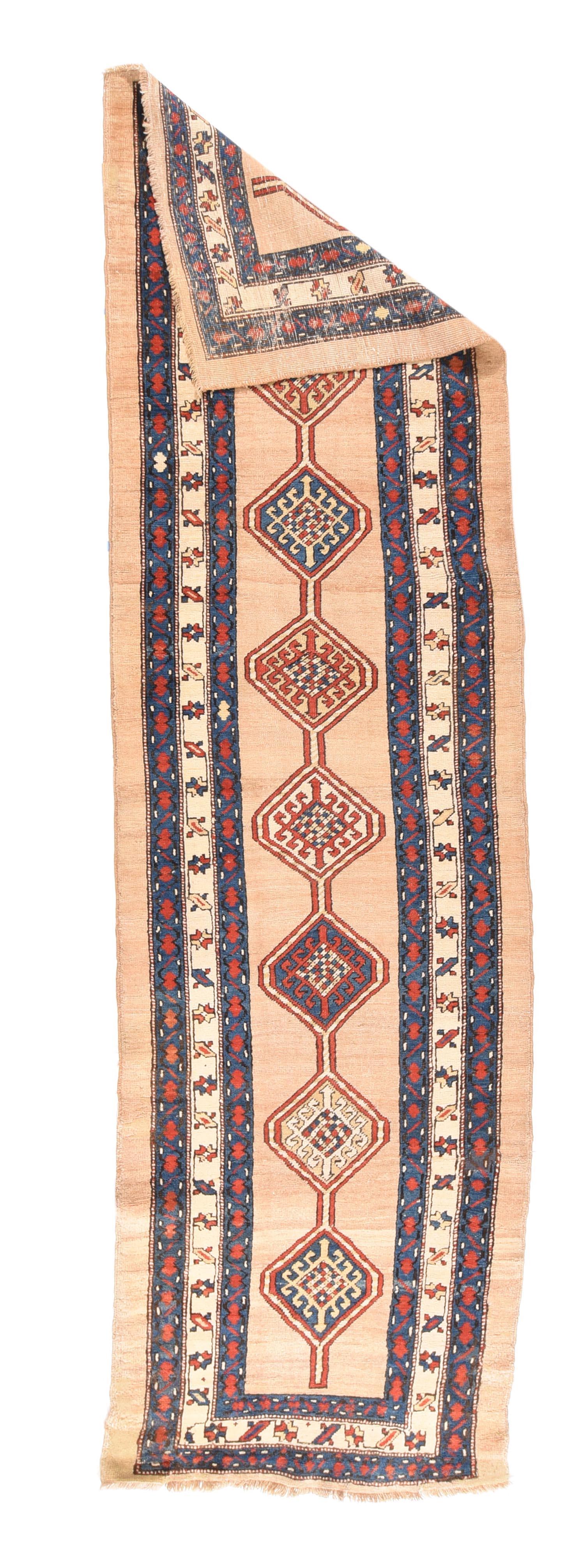 Antique Sarab Runner 3' x 10'8''. Light camel tone plain field is centred by an eight conjoint hexagon floating pole medallion, accented in red, straw, teal and ecru. Ecru main border of stars and tilted bars. Plain outer surround of milky camel.