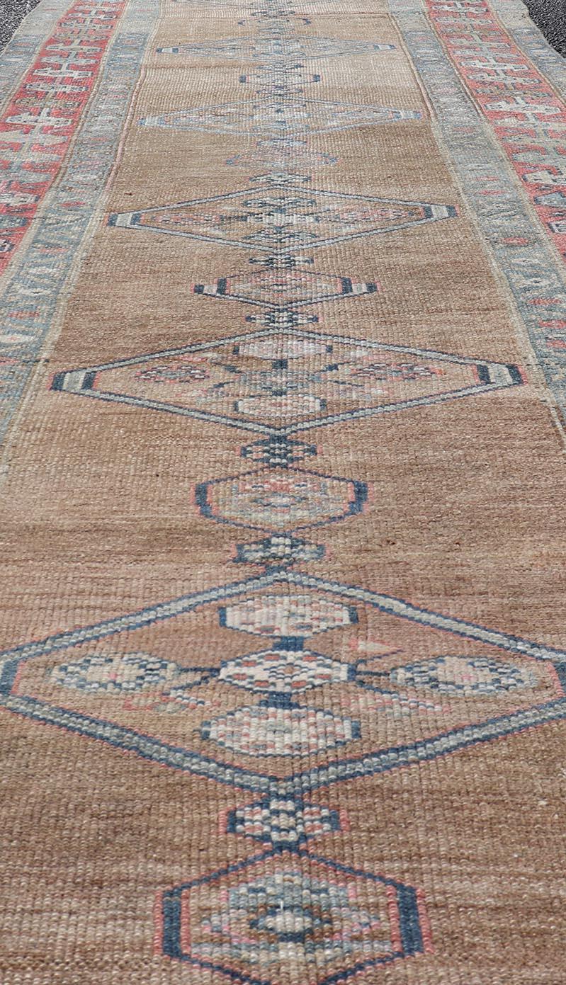 Antique Sarab Runner with Sub-Geometric Medallion Design in Red, Blue & Brown. Antique Sarab Runner, rug EMB-22134-15040; Keivan Woven Arts, country of origin / type: Persian / Sarab, circa 1910.
Measures: 3'4 x 13'2 
This antique hand-knotted Sarab
