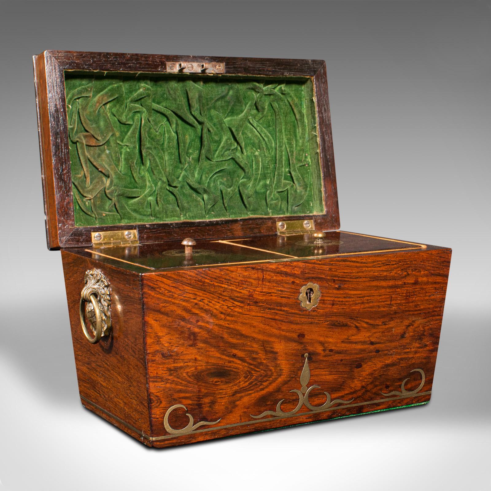 This is an antique sarcophagus tea caddy. An Anglo-Indian rosewood colonial campaign casket with brass inlay, dating to the early Victorian period, circa 1850.

Striking appearance with quality inlaid brass and a delightful sarcophagus