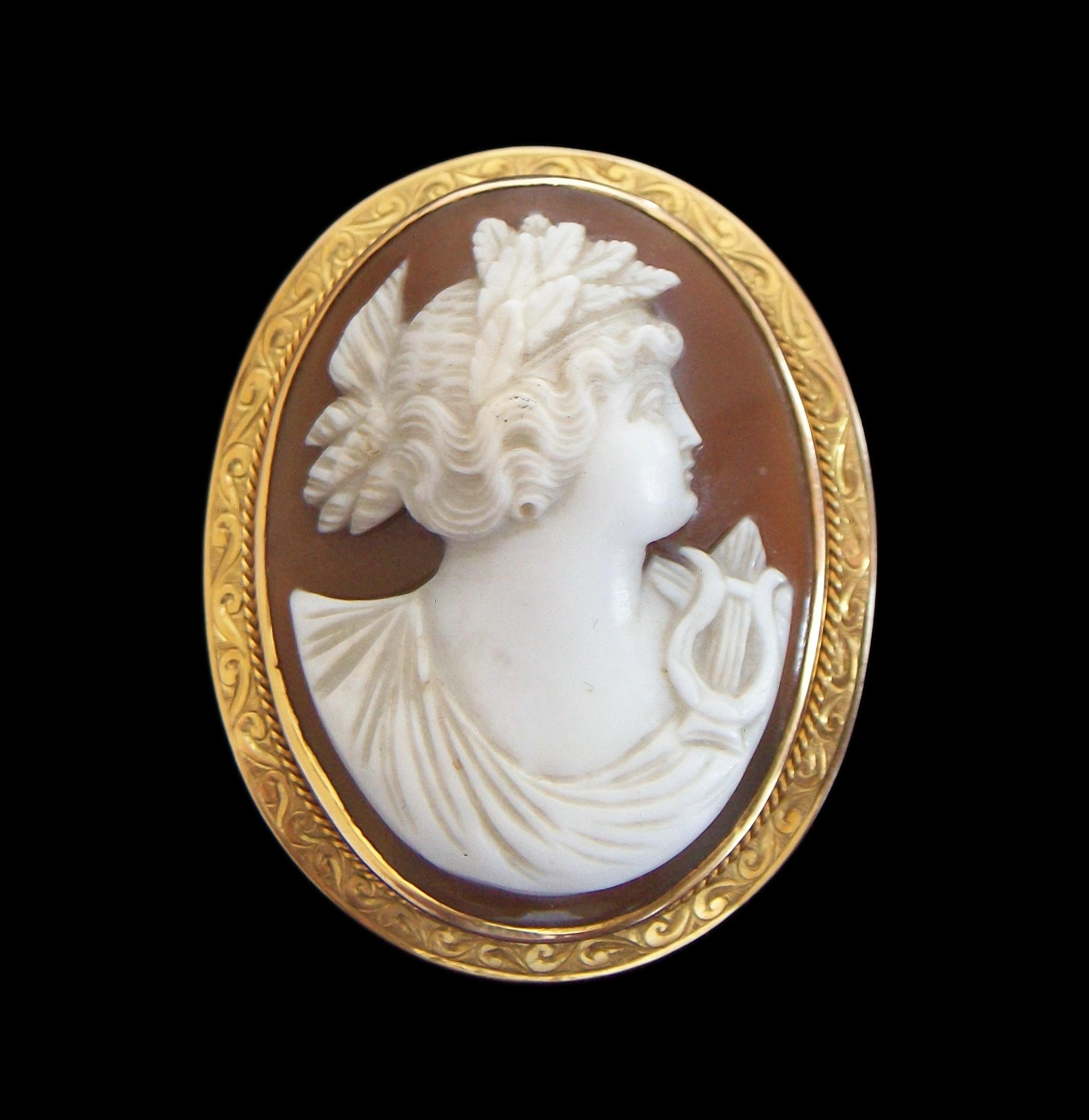 Extraordinary antique custom made goddess 'Erato' sardonyx shell cameo brooch or pendant with retractable bail (goddess 'Erato' was the muse of lyric and love poetry) - the cameo carved in deep relief and high contrast exposing the rust/brown