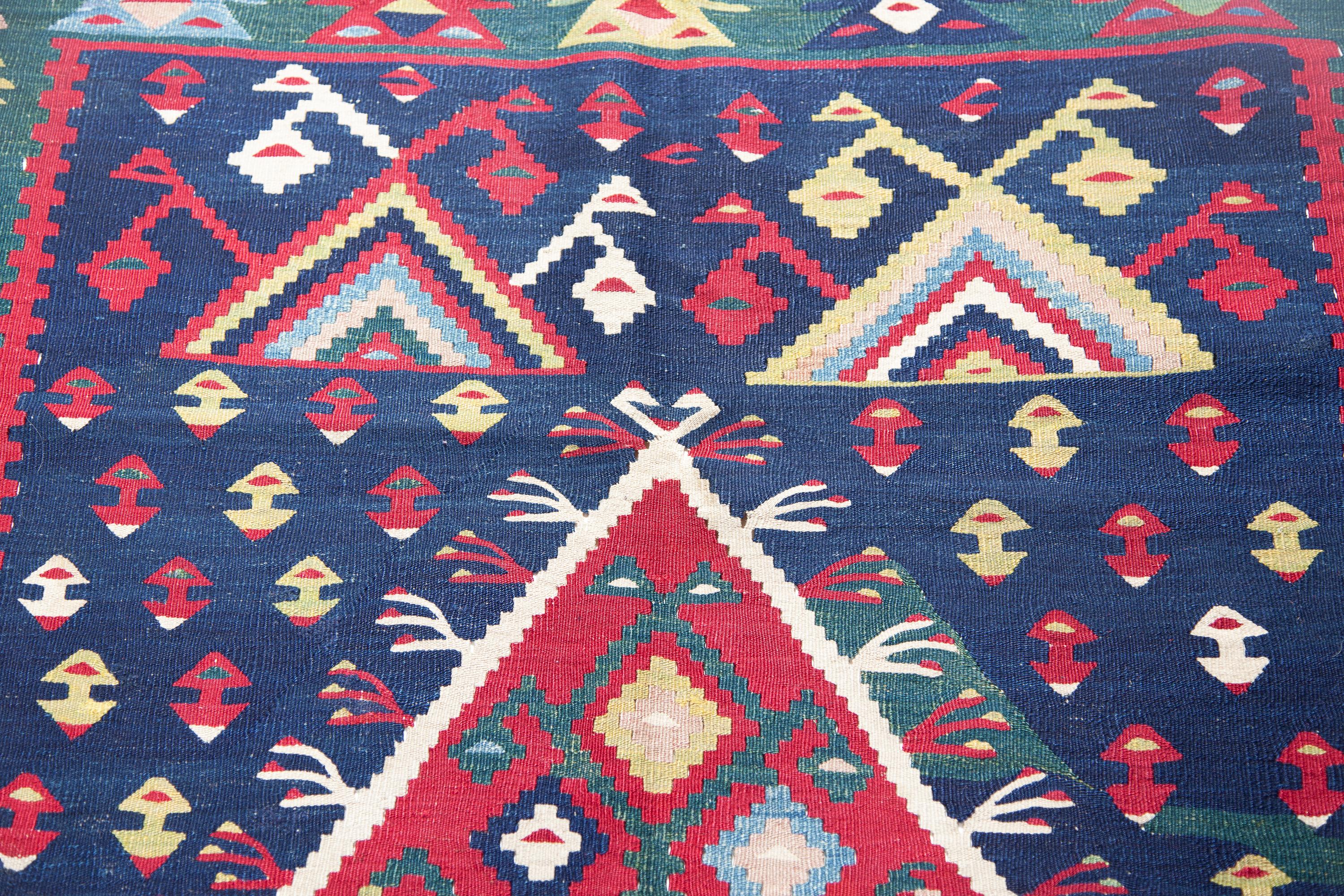 This is an antique Unique Sarkoy (Sharkoy or Şarköy) Kilim rug from Western Turkey with a rare and beautiful color composition.

Sarkoy kilims are very finely woven in slitweave in a variety of sizes and are made in one piece. Many feature the tree
