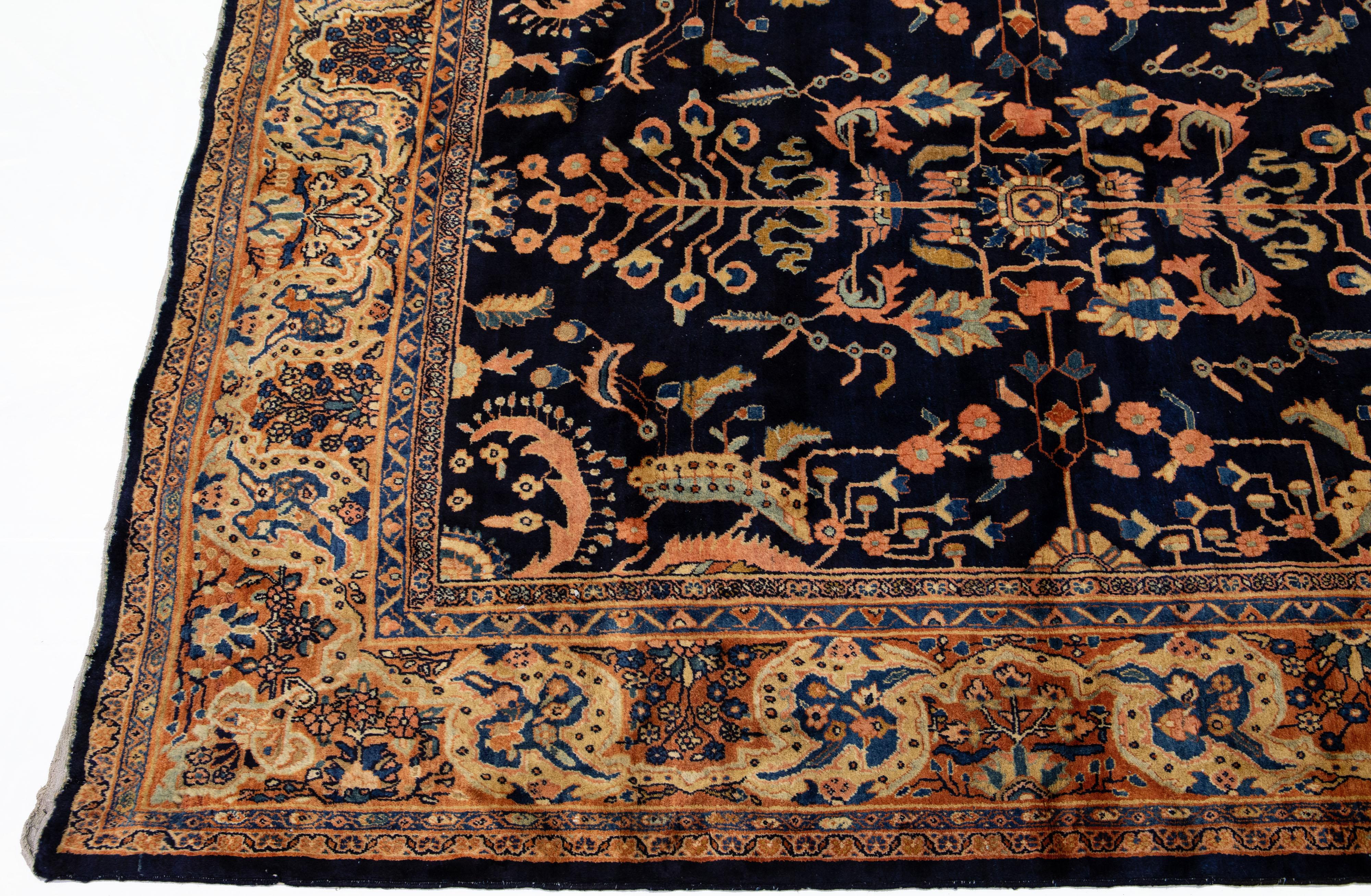 Antique Sarouk Farahan Handmade Dark Blue Persian Wool Rug with Floral Pattern In Good Condition For Sale In Norwalk, CT