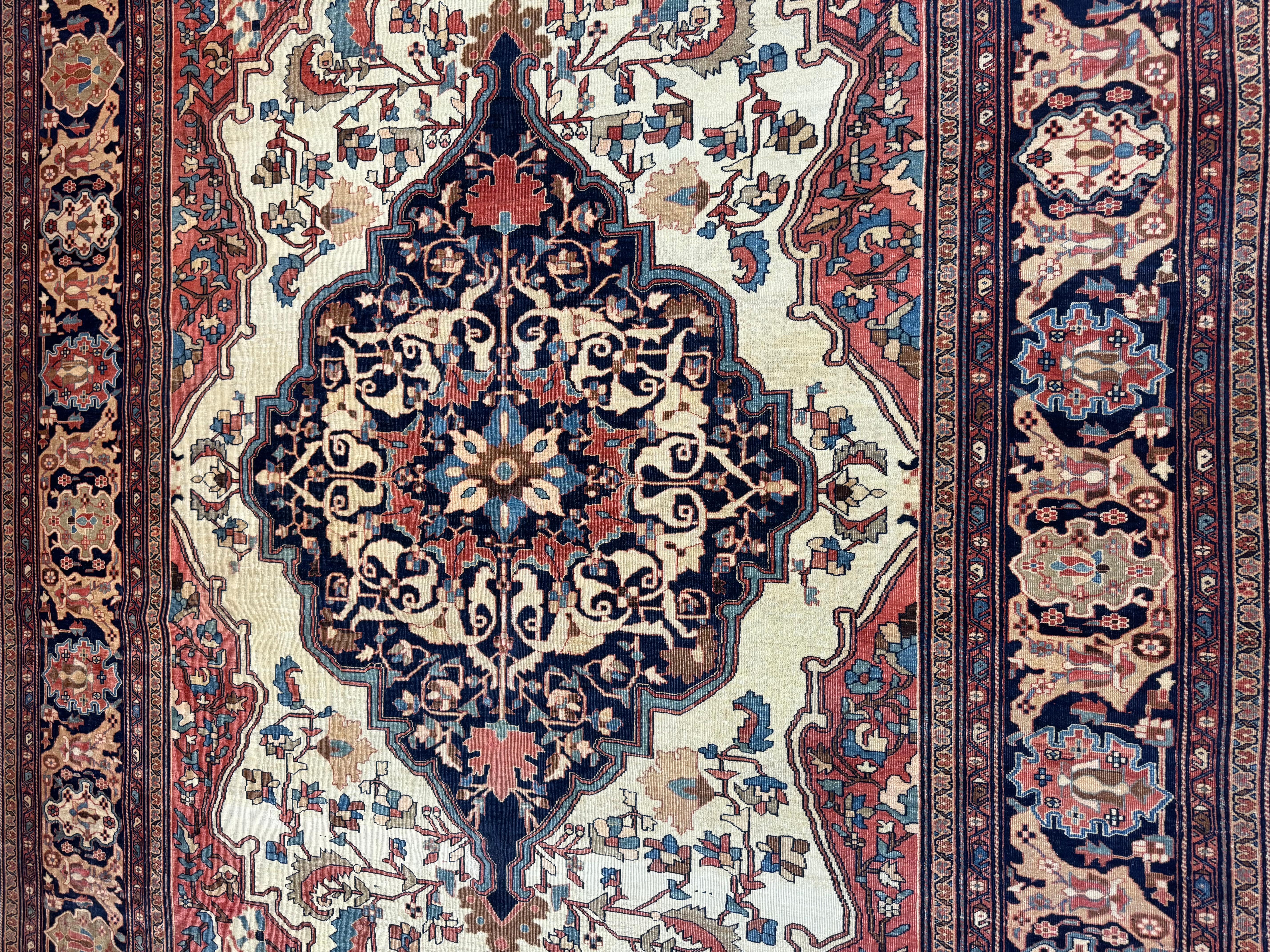 A truly stunning antique sarouk farahan rug originating from Iran in the 19th century. This rug is in excellent condition considering its rich history and is truly a breathtaking rug.  Feel free to message me in regards to this listing or any other