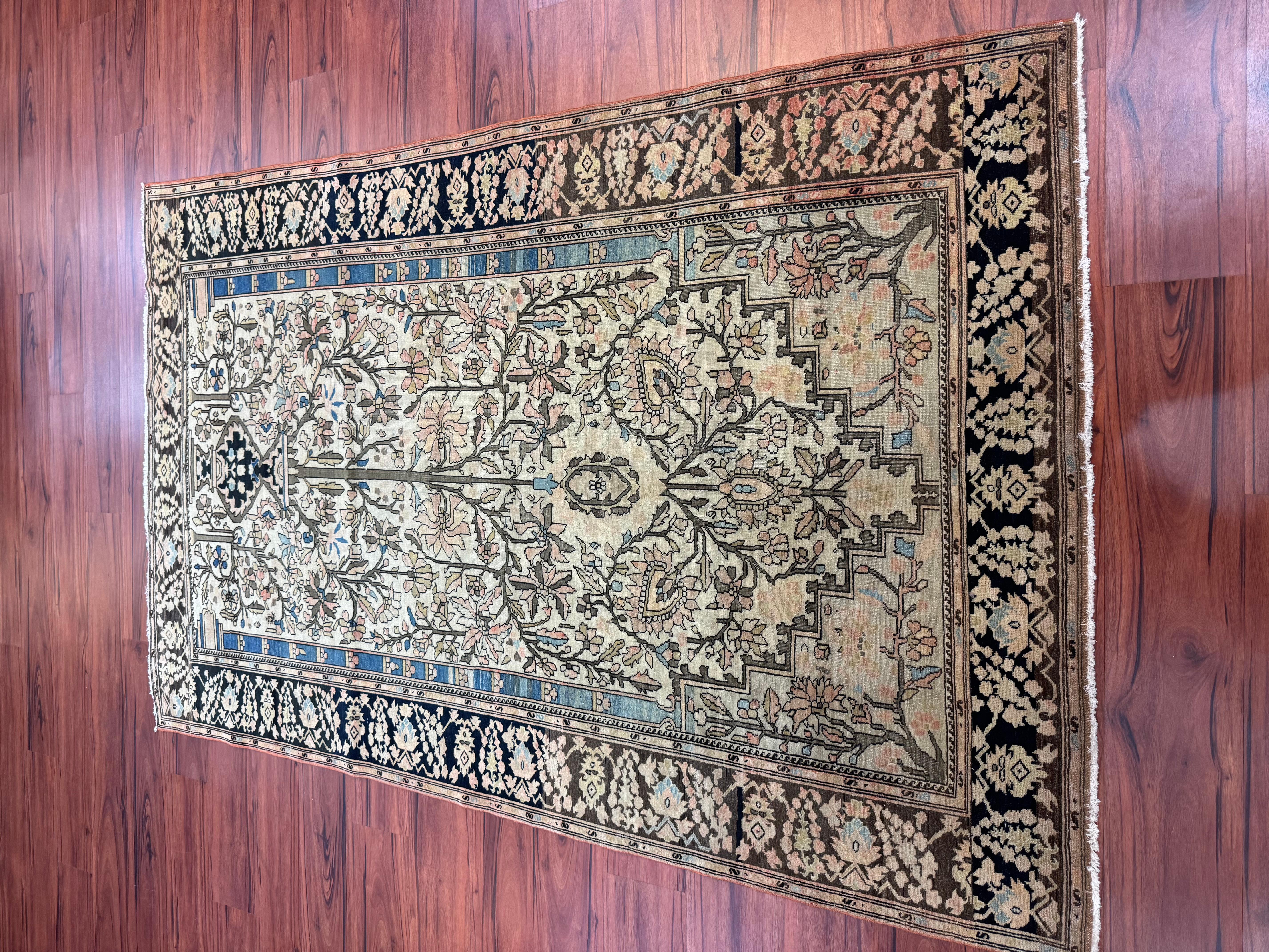 A stunning antique Sarouk Farahan originating from Iran in the 19th century. This rug is in excellent condition considering its rich history! Feel free to message me in regards to this listing or any other posted on my page. 