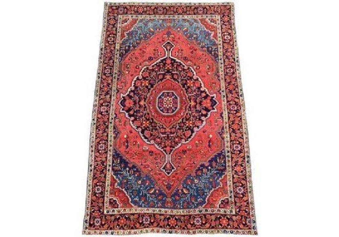 A fabulous antique Sarouk Ferahan rug, handwoven circa 1910 with a large medallion design on a rich tomato red field. Lovely wool quality and stunning secondary colours of blues, greens and golds.

Size: 2.20m x 1.42m (7ft 3in x 4ft 8in)

This rug