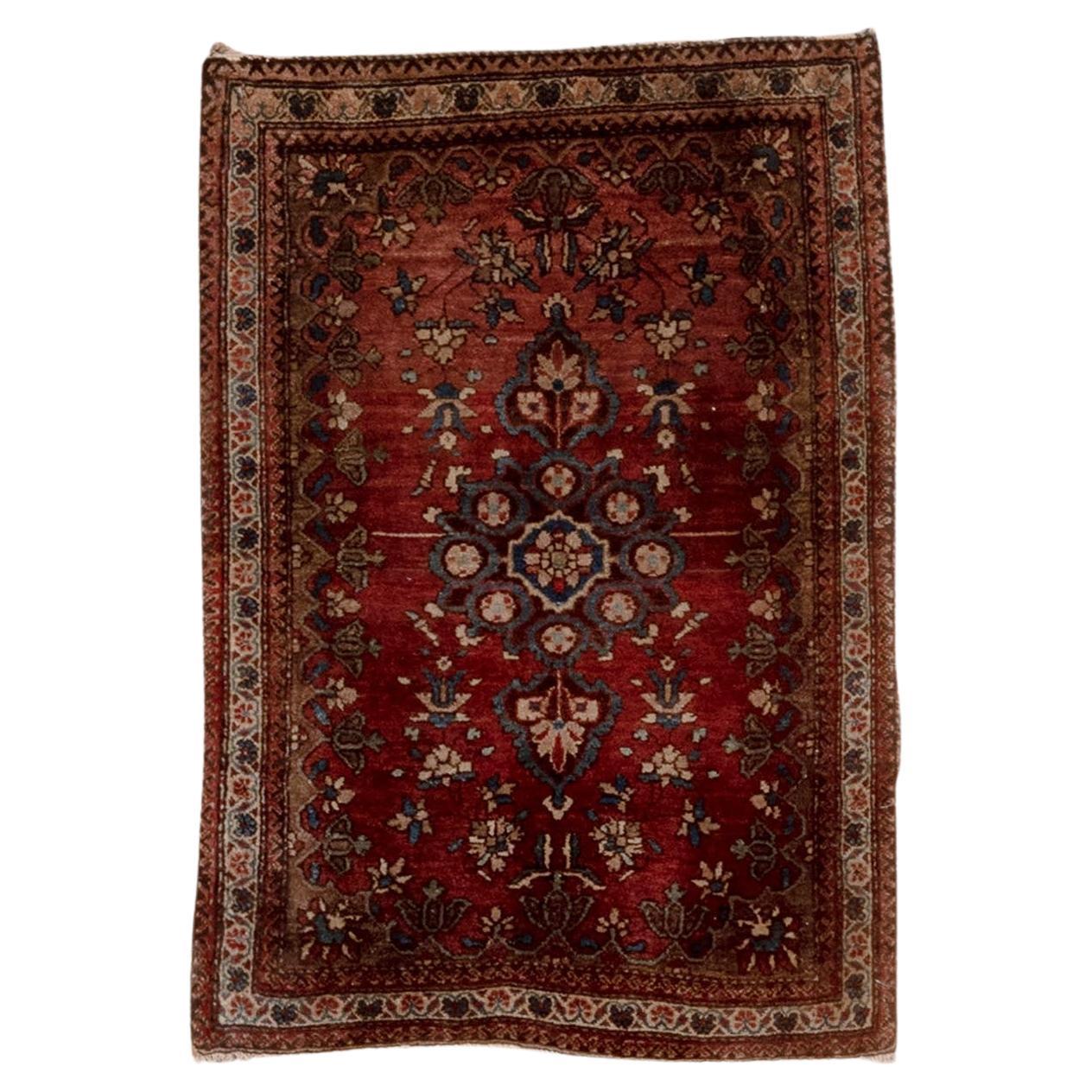 Antique Sarouk in Rusted Red and Aesthetic Fades Throughout For Sale
