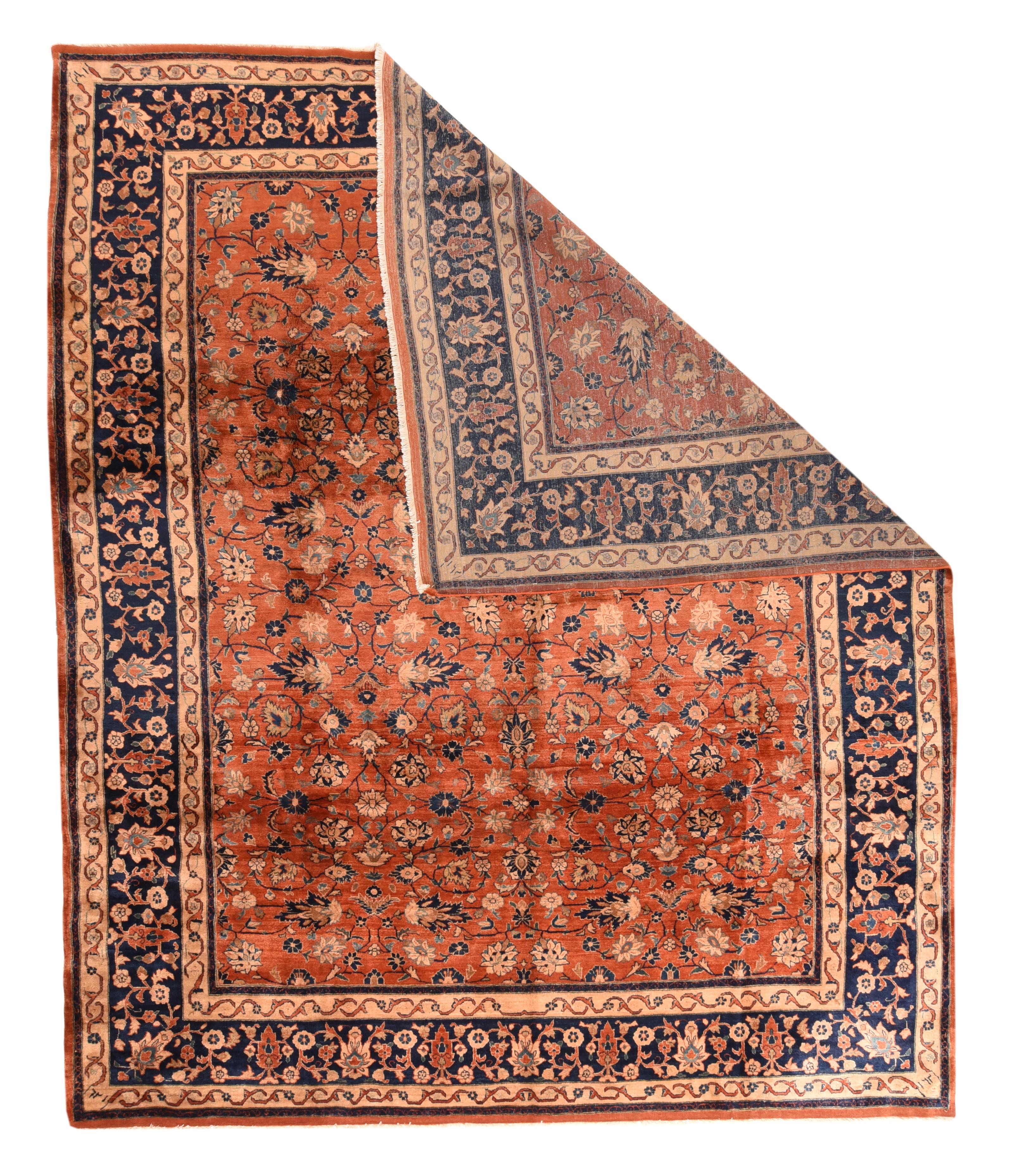 Antique Sarouk Mohajeran Rug 9'2'' x 11'. Abrashed rusty red field with an unusual allover pattern of volute vine scrolls, palmettes and rosettes. Navy border of cypresses, narrow petal palmettes, rosettes and connecting vinery. Matching straw-ecru