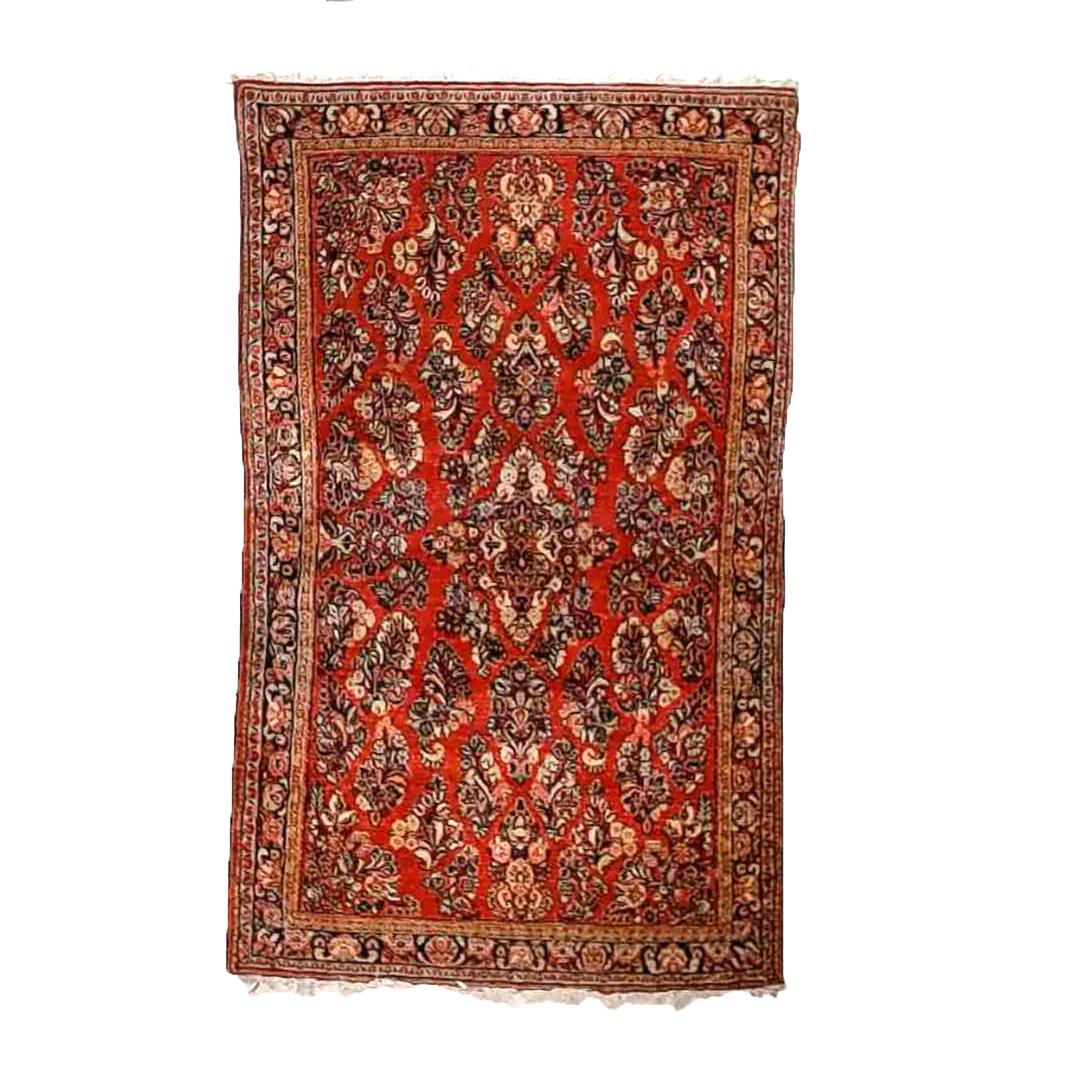An antique Sarouk oriental rug offers wool construction with floral elements throughout, circa 1920

Measures - 75.5