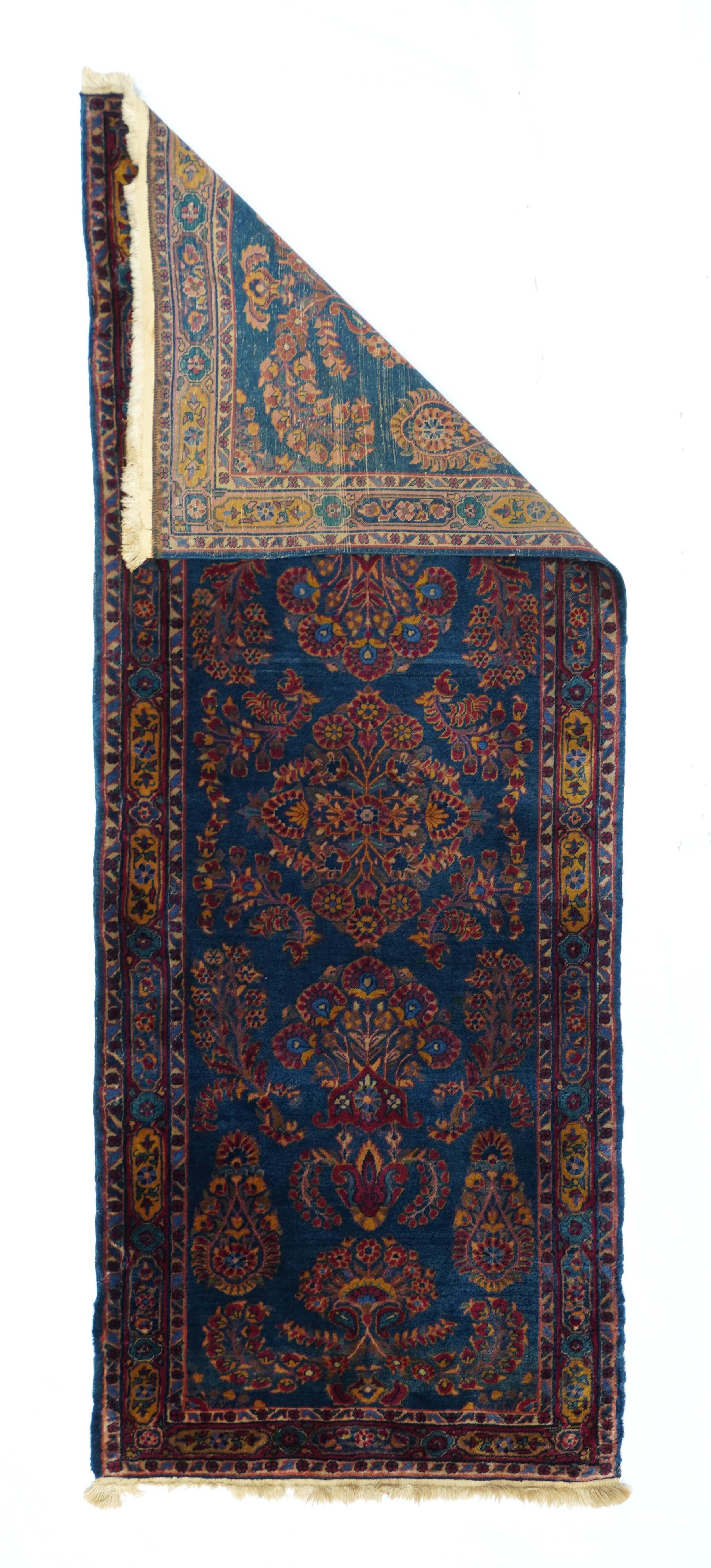 Antique Sarouk rug. This west Persian village piece shows an unusual abrashed royal blue field adorned with the detached floral spray pattern common to interwar 