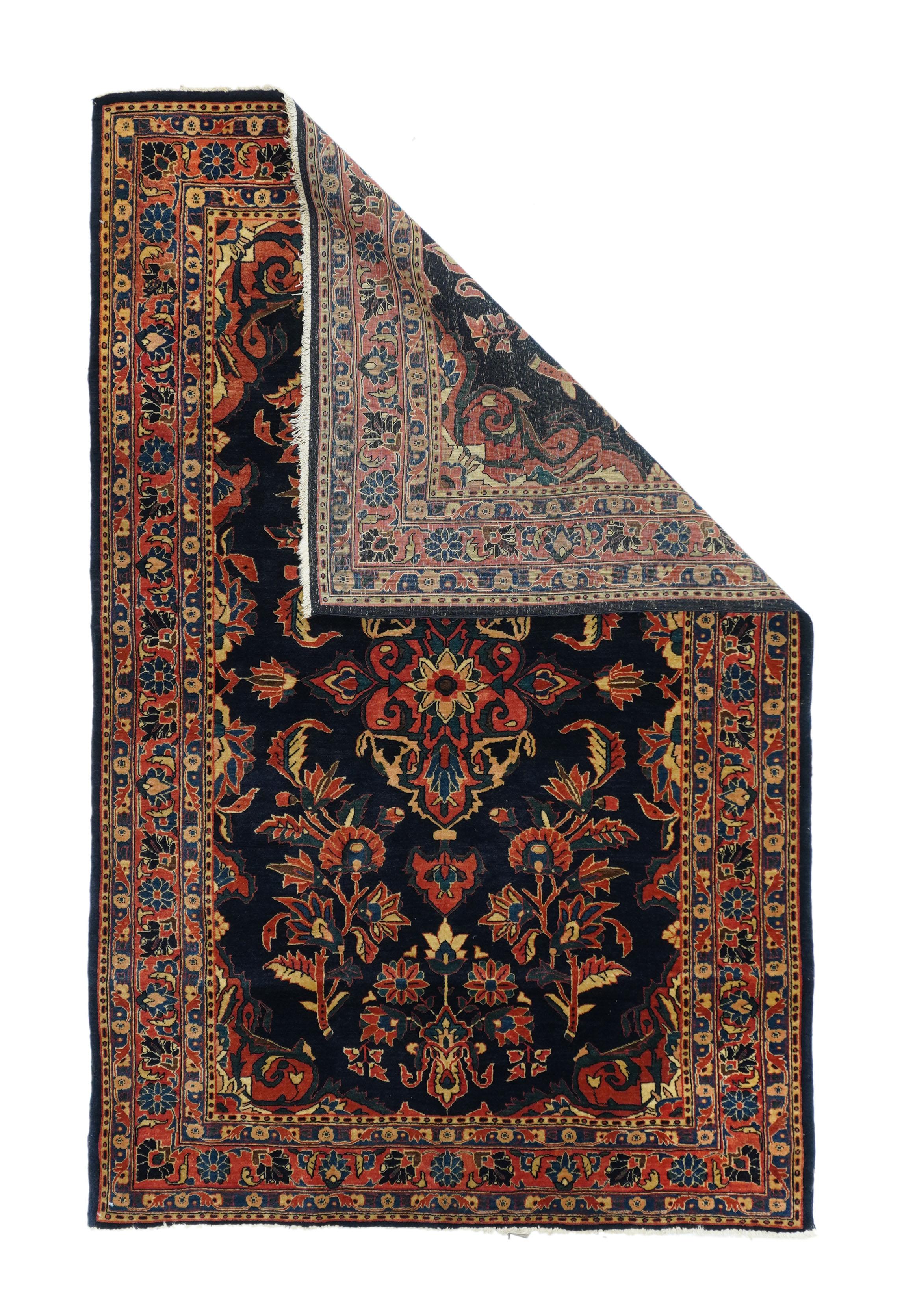 Antique Sarouk rug 4'4'' x 6'6''. Well-woven, dark blue ground interwar Sarouks are often attributed to Mohajeran village, This scatter shows a navy field with large carnation sprays, barbed leaves and a small central petal octogramme. Narrow red