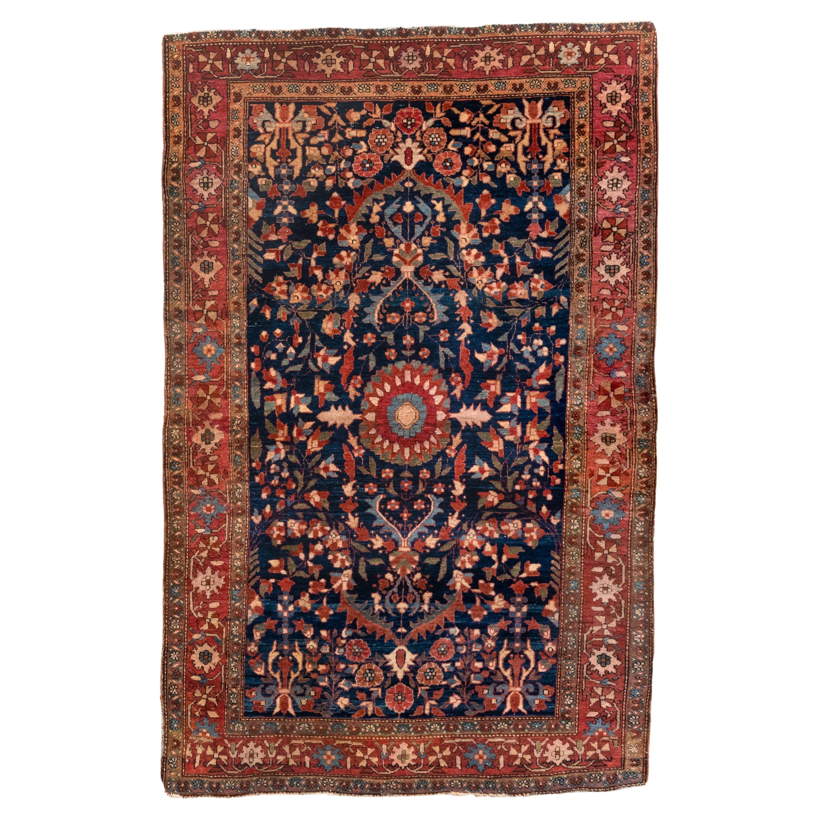 Antique Sarouk Rug with A Navy Field, Red Border and Round Medallion