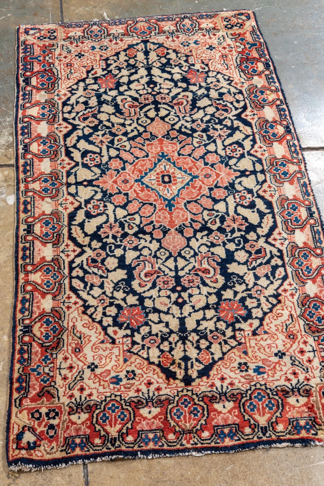 Persian Antique Sarouk with Navy Field and Floral Design For Sale
