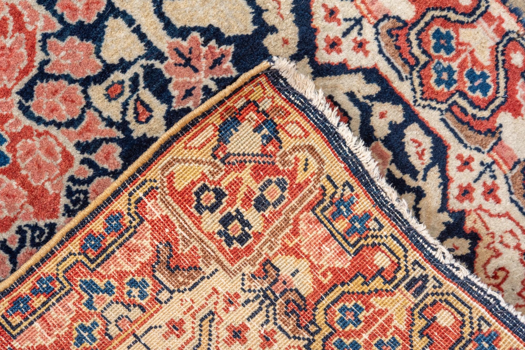 20th Century Antique Sarouk with Navy Field and Floral Design For Sale