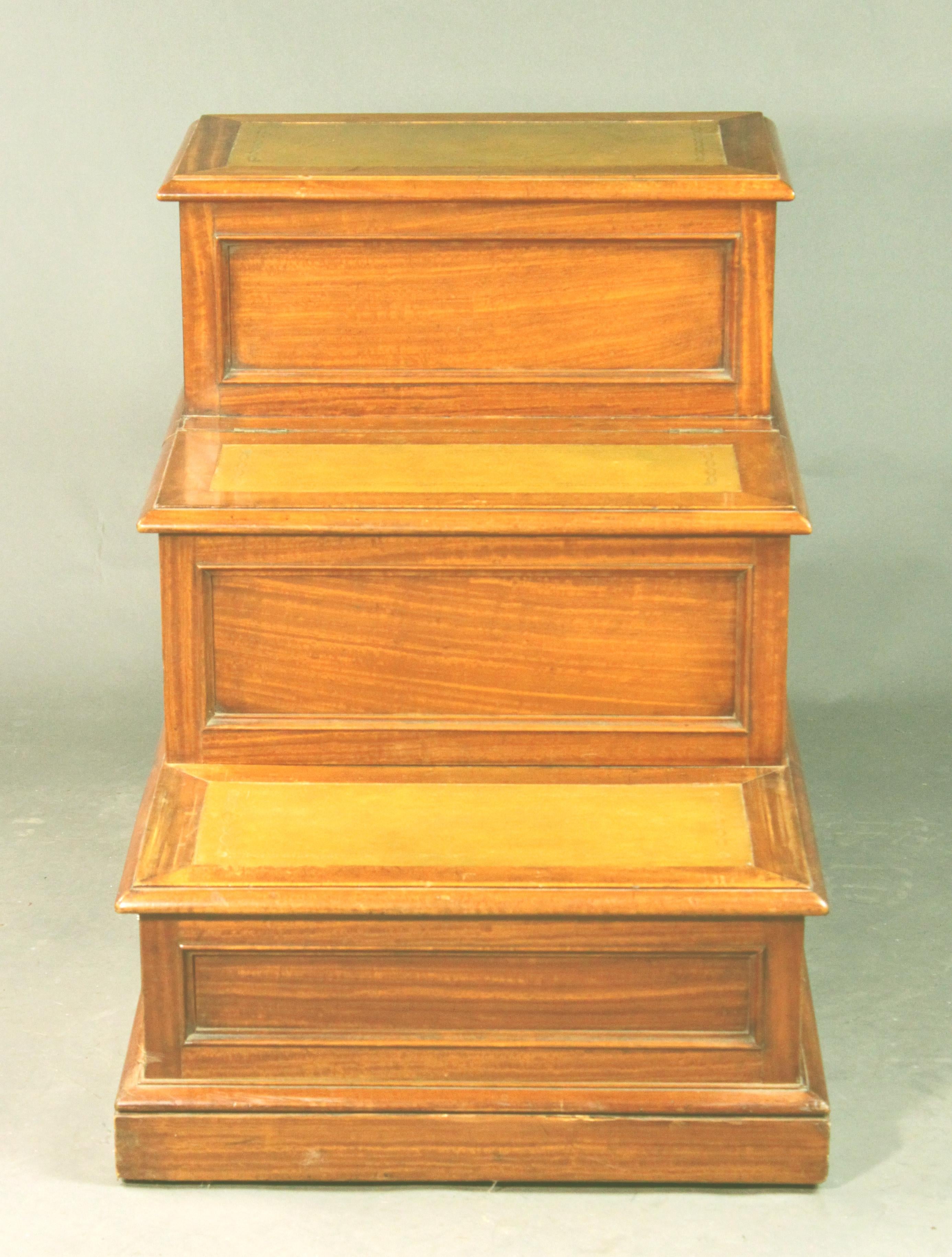 Unusual satinwood bedsteps of a good generous size; still retains its original interior though this could easily be modified; three steps with leather inserts on each step; was originally a piece of furniture for the dining room or library.