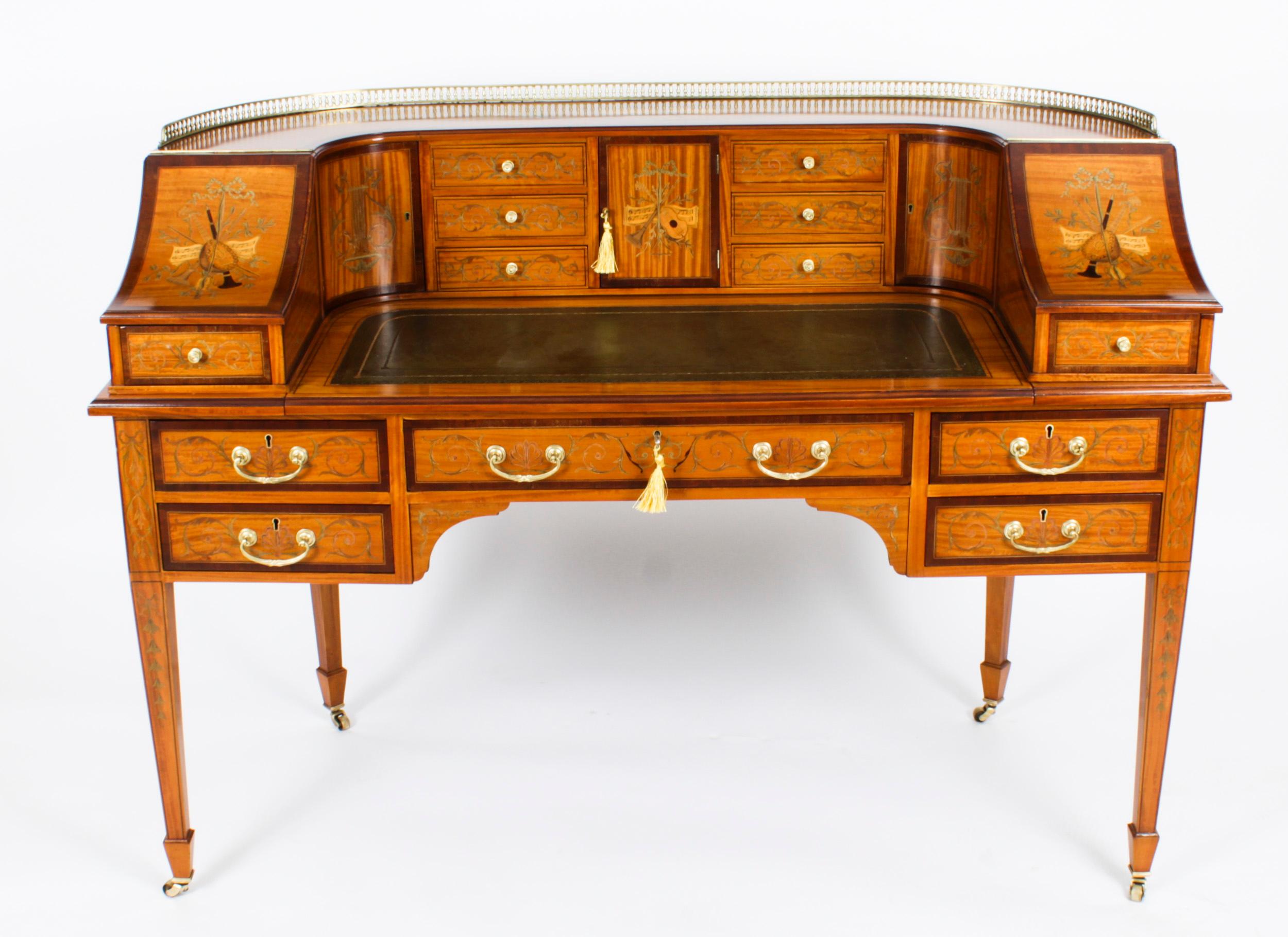 This is a beautiful antique late Victorian satinwood Carlton House Desk, by the renowned retailer and cabinet maker Druce & Co, circa 1880 in date.
 
This beautiful desk is made from satinwood, which has been bordered with boxwood and ebony lines