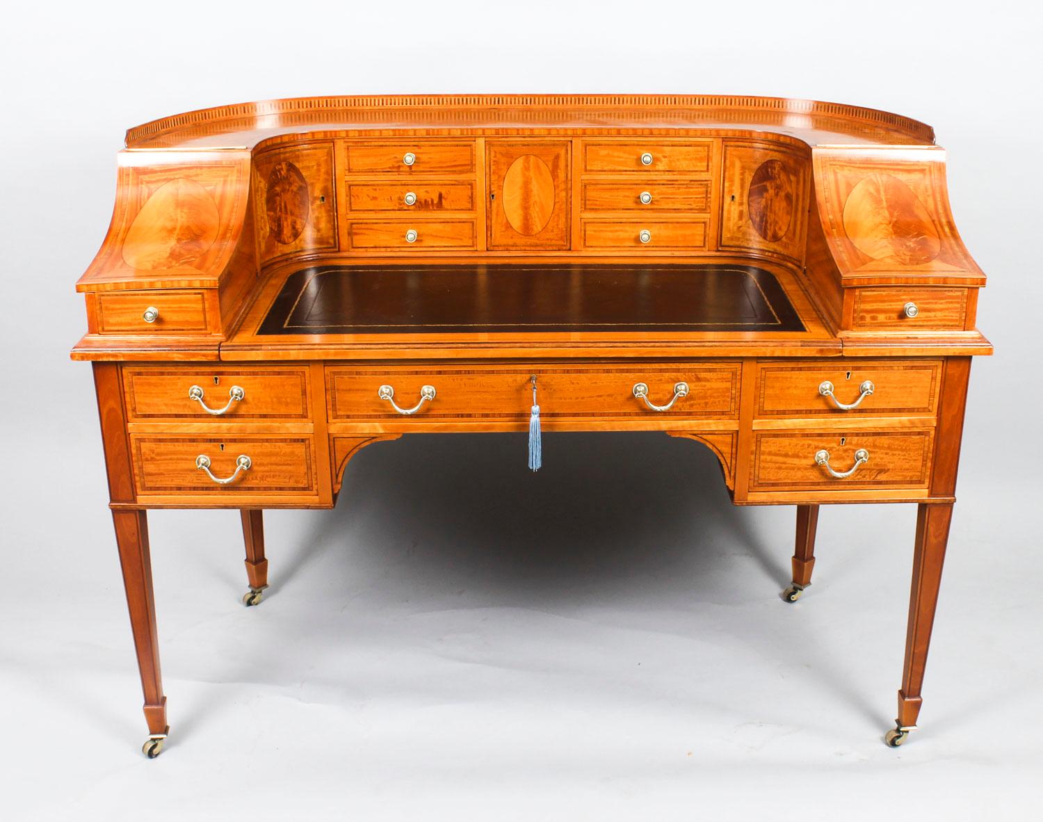 This is a beautiful antique late Victorian satinwood Carlton House desk, by the renowned retailer and manufacturer Maple & Co, circa 1880 in date.

This beautiful desk is made from satinwood, which has been crossbanded in Tulipwood bordered with