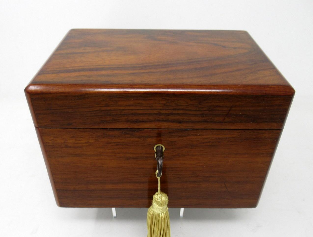 A superb example of an English early Victorian period well grained flame mahogany double interior section tea caddy of rectangular outline, compact proportions and outstanding quality, the hinged lid with inlaid edging of satinwood, complete with