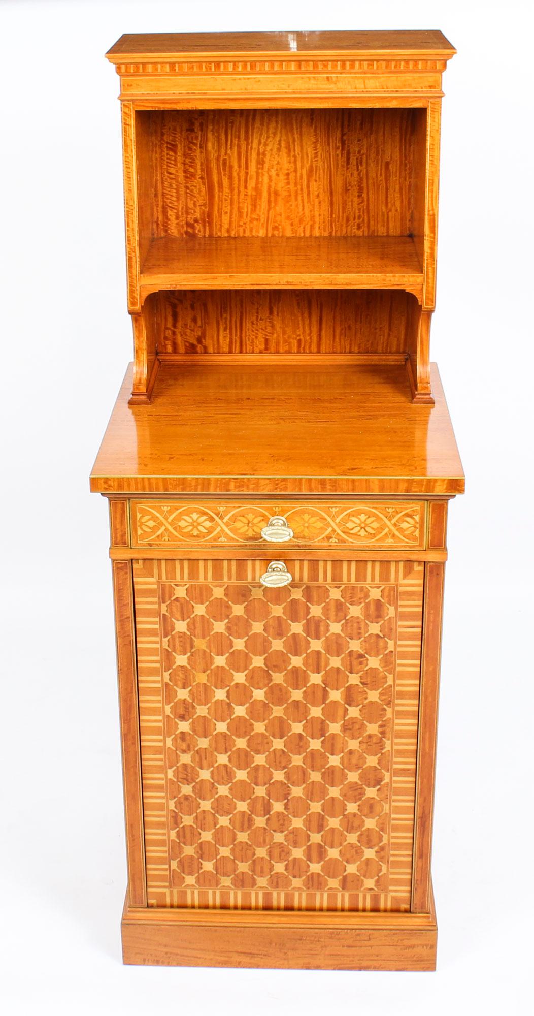 This is a fabulous Antique satinwood side cabinet with marquetry and parquetry decoration by Waring and Gillow, circa 1880 in date.

It has a decorative raised open back fitted with a shelf above a useful central drawer with a pull out cupboard