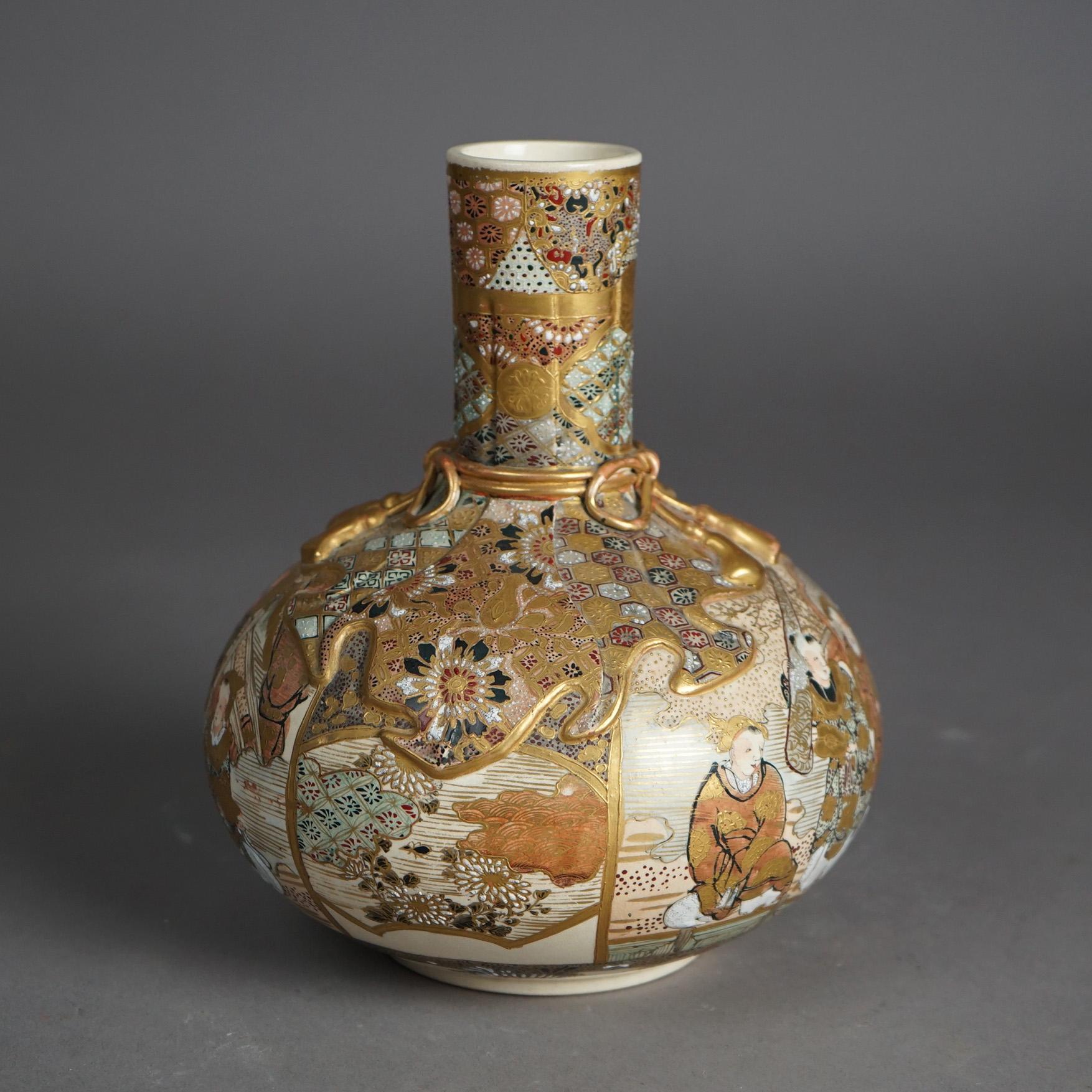 An antique Satsuma Meiji bottle vase offers porcelain construction with hand painted and gilt genre scenes having figures throughout, c1910

Measures - 8.25