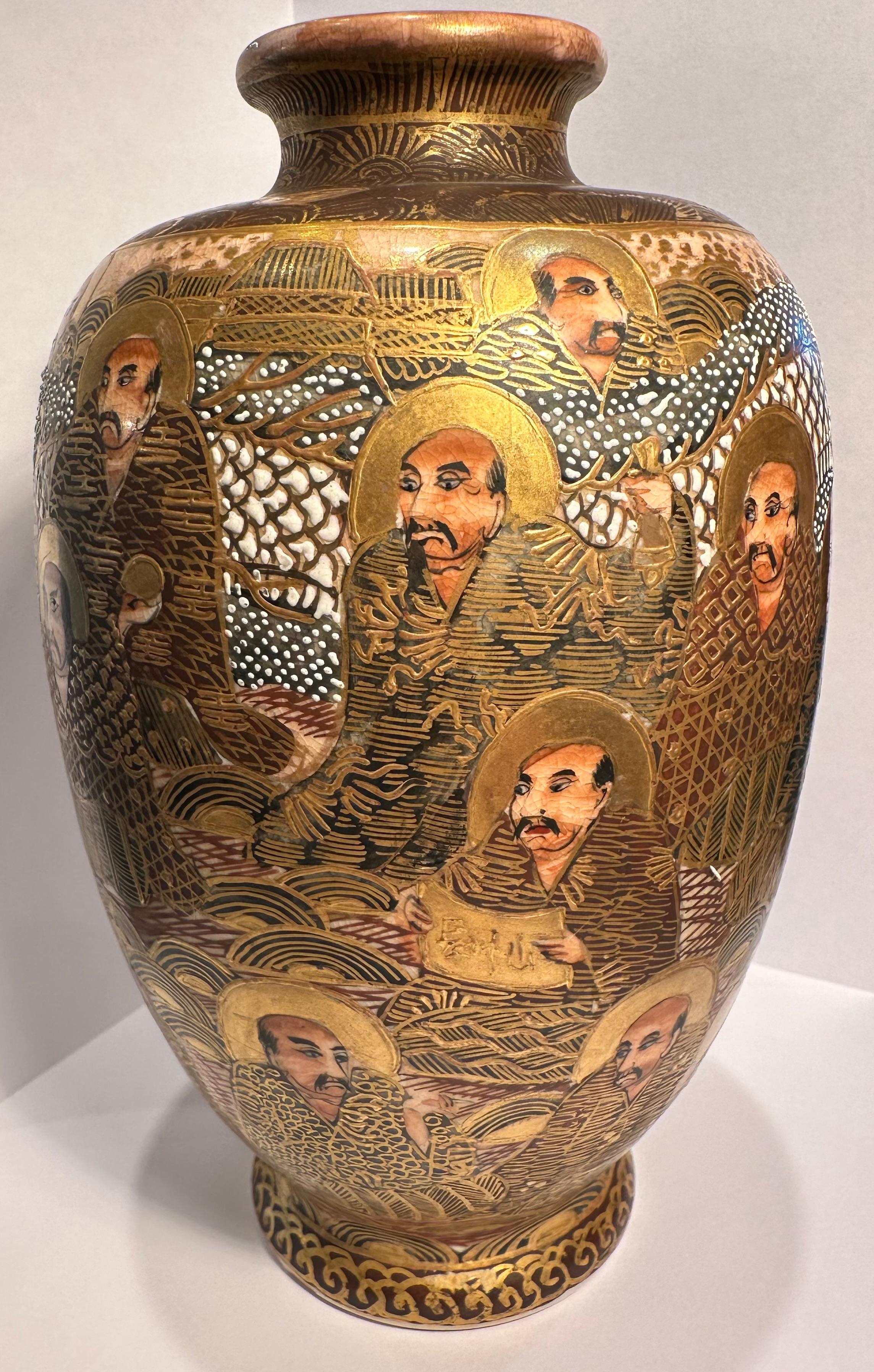 Hand-Crafted Antique Satsuma One Thousand Faces and Dragon Meiji Period Baluster Shaped Vase For Sale