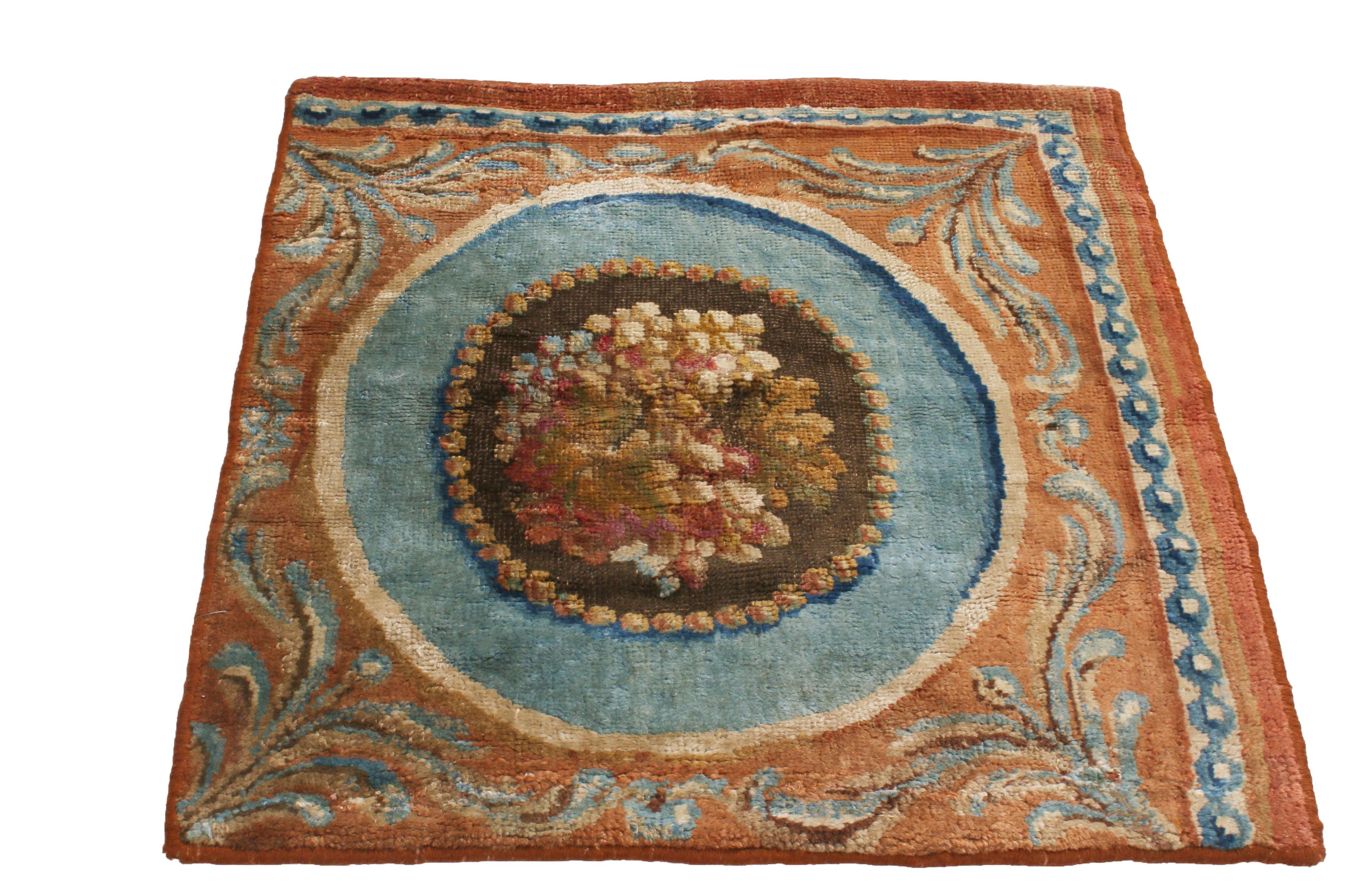 Originating from France in the 1800s, this antique Savonniere rug fragment was hand knotted with wool pile hailing from one of the most widely regarded European rug manufacturers for multiple centuries, often paralleling the most treasured Aubusson