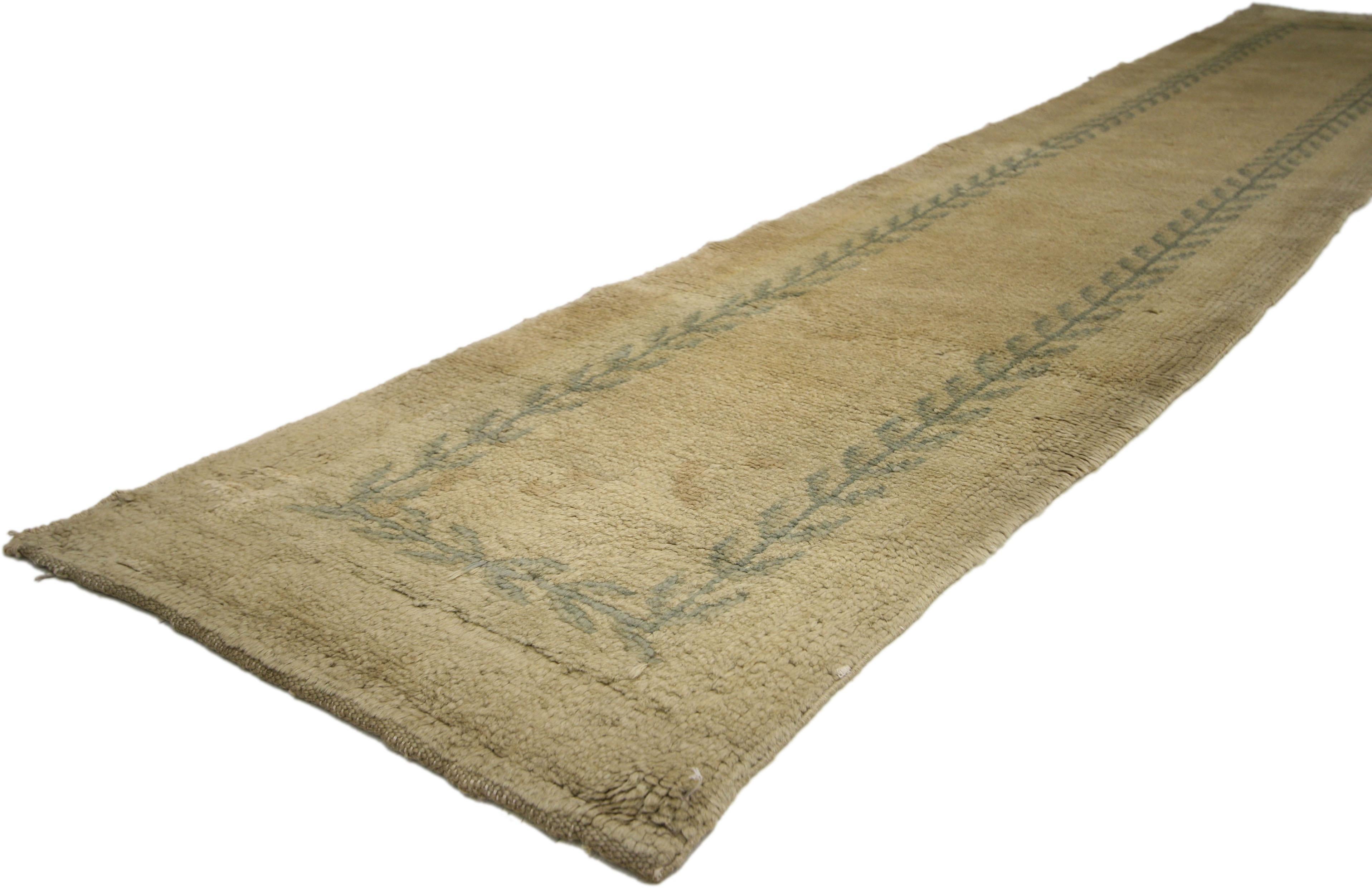 73249 Antique Savonnerie Runner with French Country Style, Narrow Hallway Runner. This hand-knotted wool antique Savonnerie runner features a French Country style. The narrow antique Savonnerie runner displays an open field with a simple wreath like