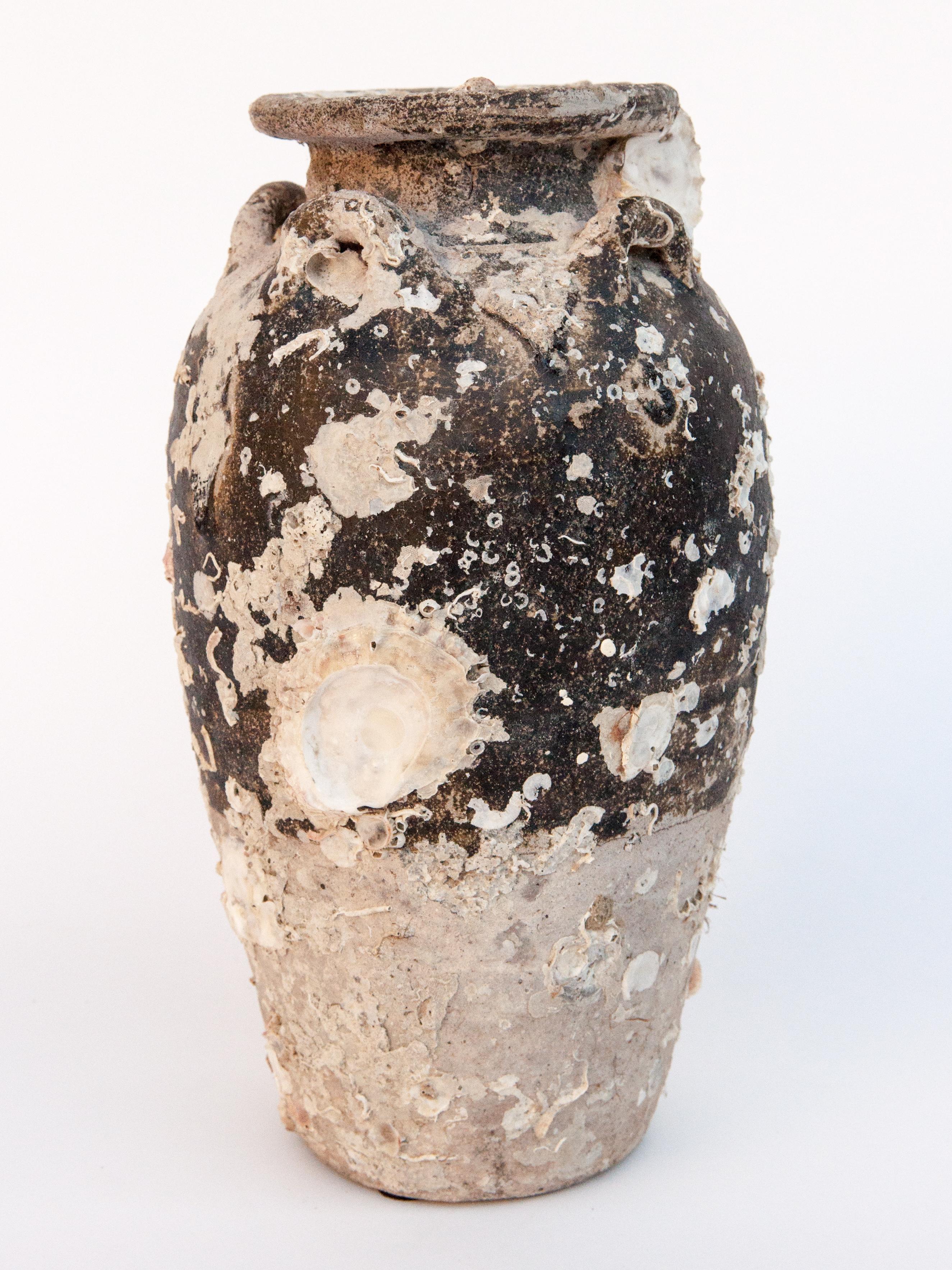 Antique Sawankhalok Jar with Encrustations. Sawankhalok, Thailand, 15th century.
This jar originates from the kilns of central Thailand centered around the area of Si Sachanalai dating to the Sukhothai period. Sawankhalok ceramics were widely