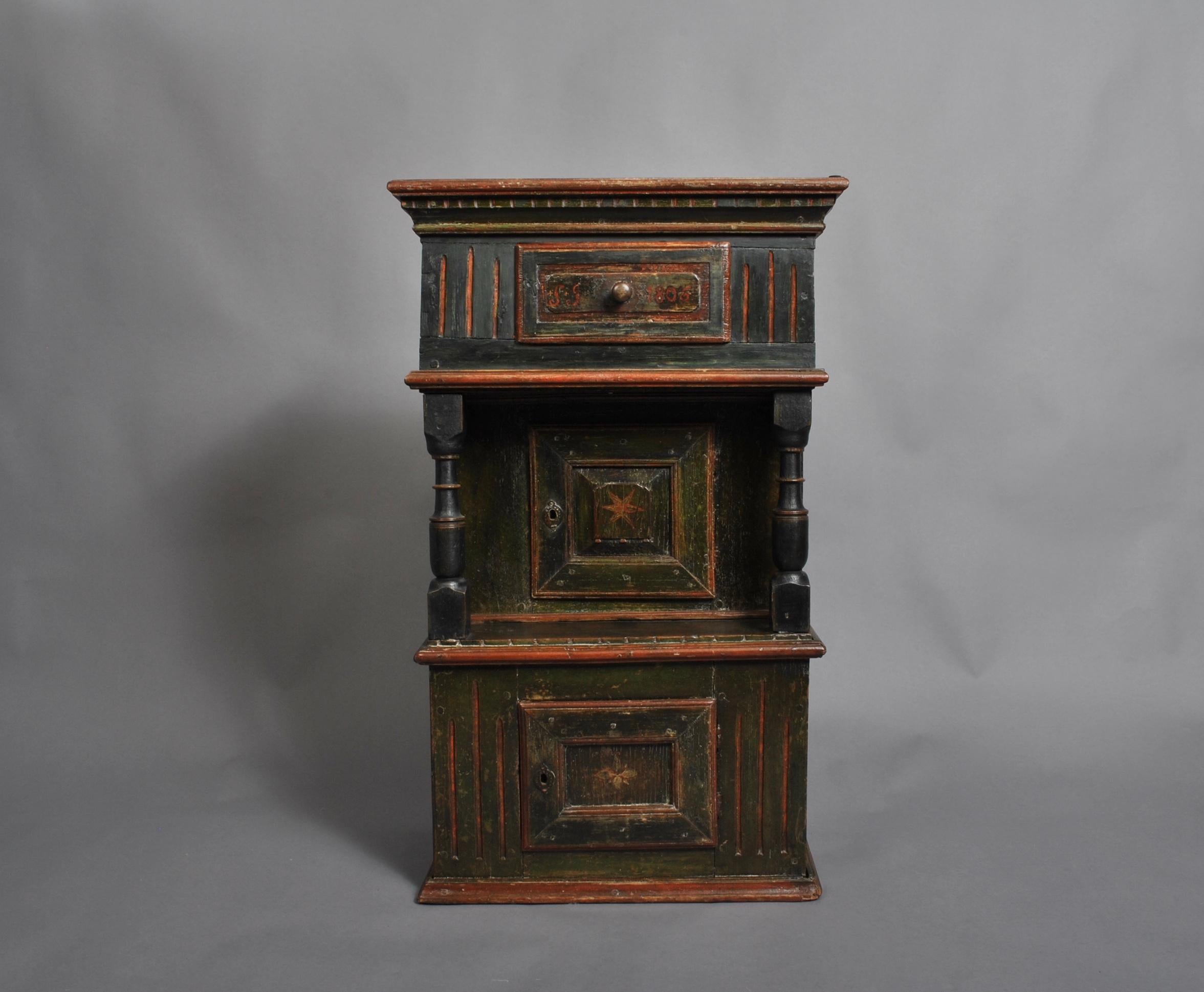 Handcrafted and folk painted rustic cabinet from Scandinavia dated 1806. Wonderful metal worked hand-wrought fittings. Oak and pine construction. For wall or counter mounting. A very characterful country piece.