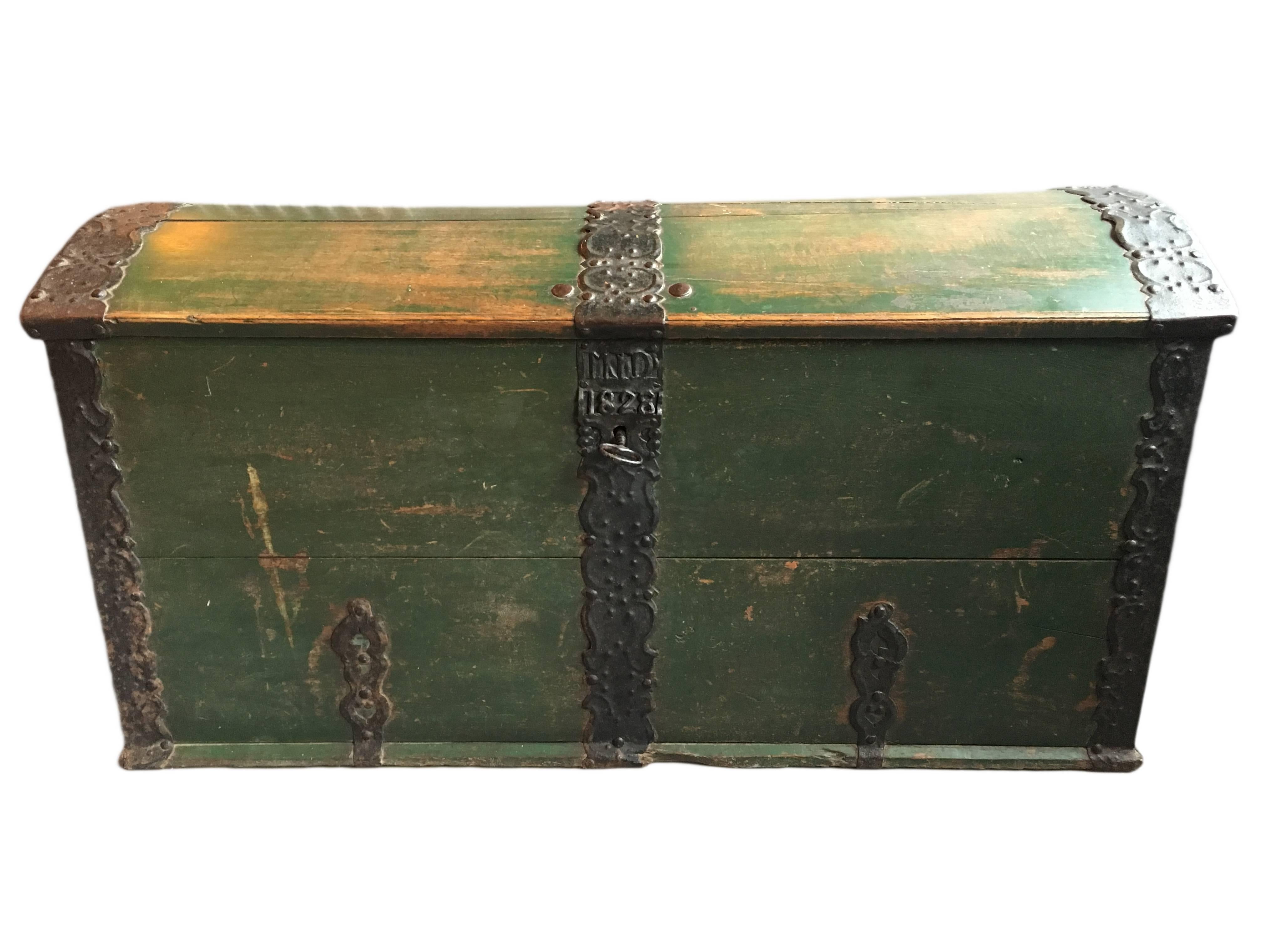 Very large antique Folk Art painted Scandinavian oak trunk dated 1828. All handwrought metal work with original functioning key and lock. An impressive and substantial piece of useful decorative furniture.