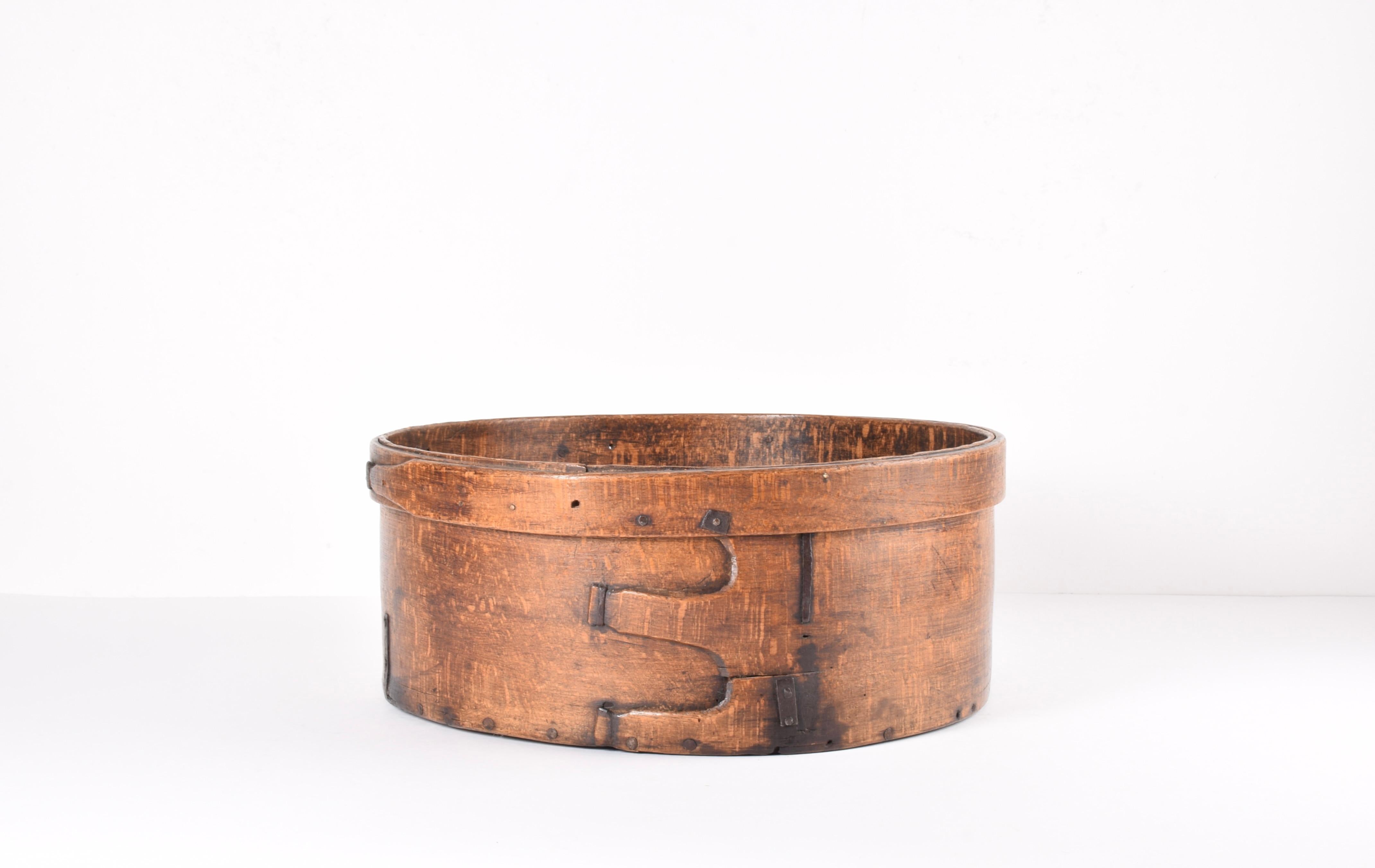 Very large Antique Scandinavian basket made from bent wood.
We suppose it´s from circa last half of the 19th century. 

The basket is assembled with iron pieces and nails and has a decorative junction at front.

The basket is full of charm and has a