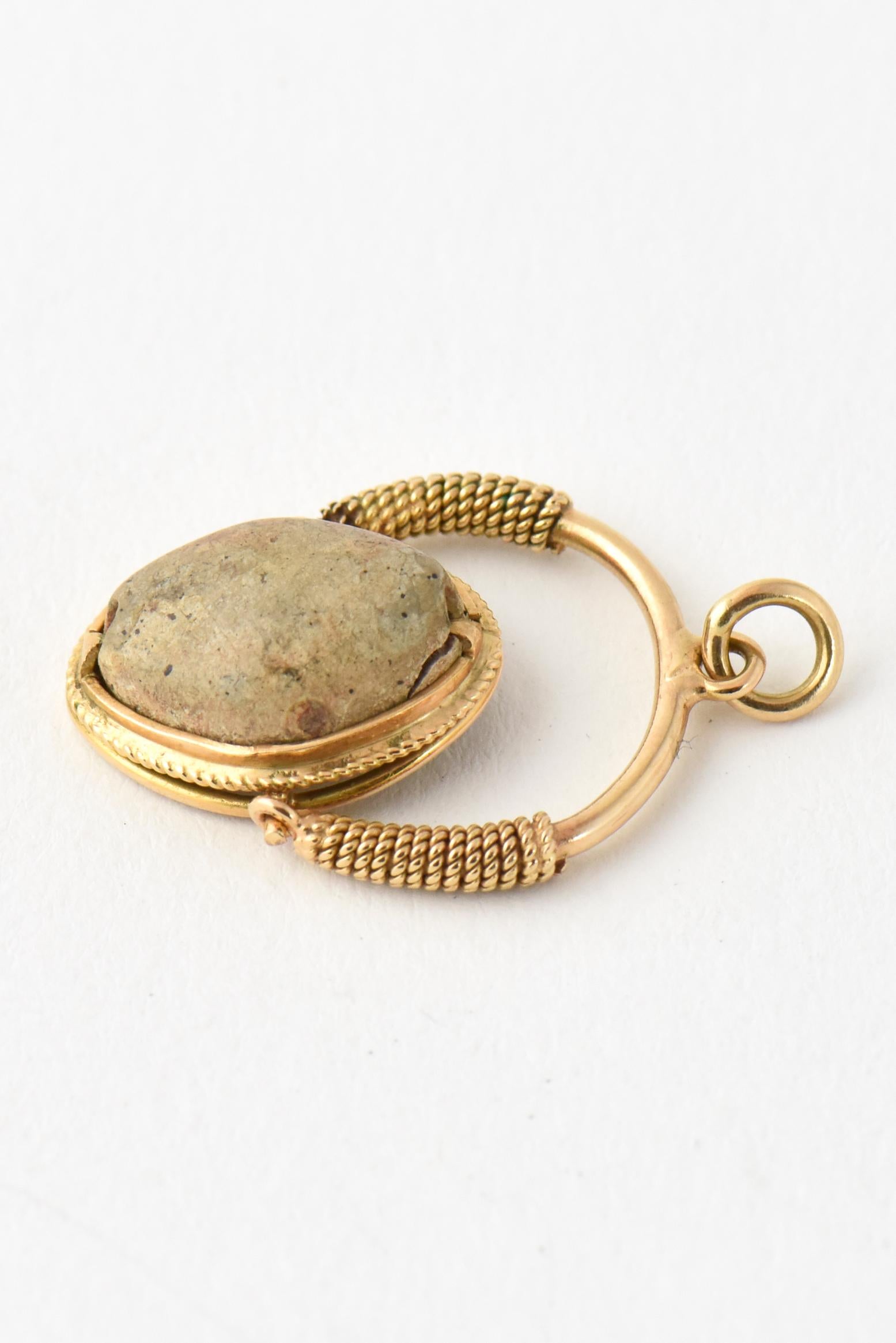 Antique 18k gold scarab pendant fob. Caving of a woman on the underside of scarab.