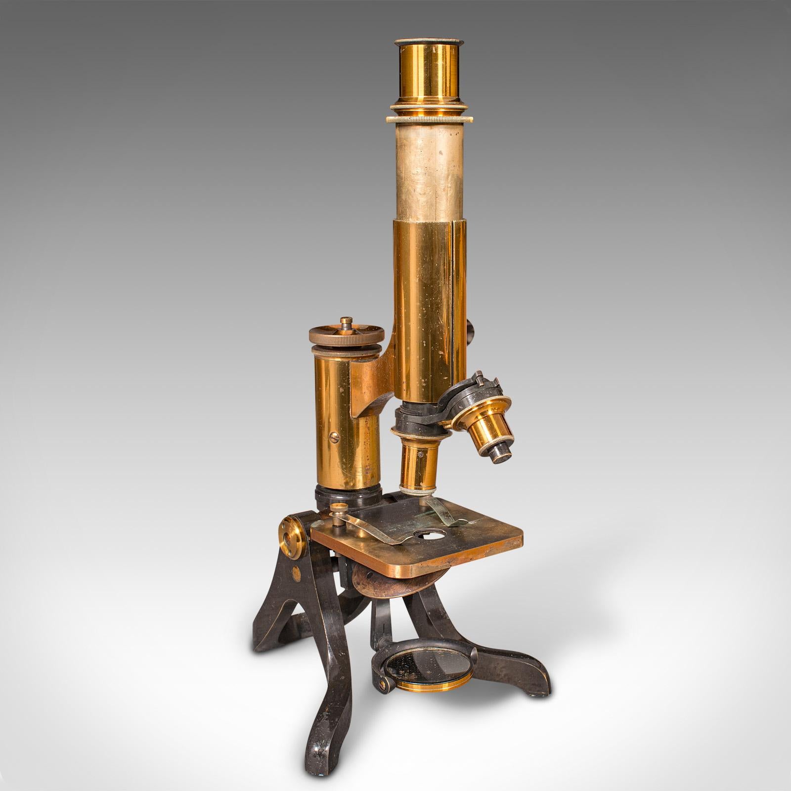 This is an antique scholar's microscope. An English, brass and enamelled metal scientific instrument by Henry Crouch, dating to the late Victorian period, circa 1900.

Appealing microscope with a quality finish and range of accessories
Displays a