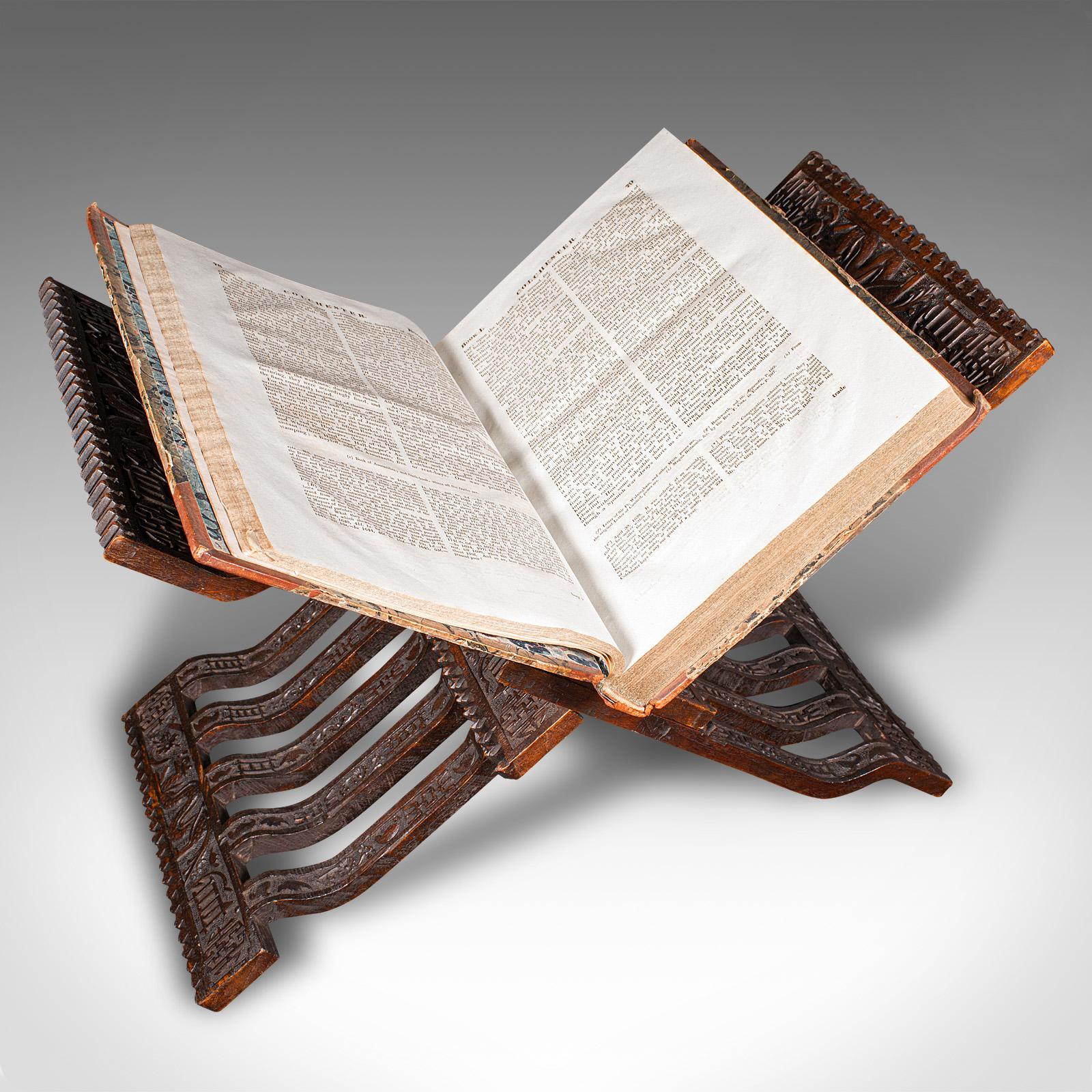 This is a fine antique scholar’s reading stand. A Siamese, mahogany book or sermon pedestal, dating to the late Victorian period, circa 1880. Rich in cultural symbolism and exquisitely crafted, this stand is a distinctive addition to any reading