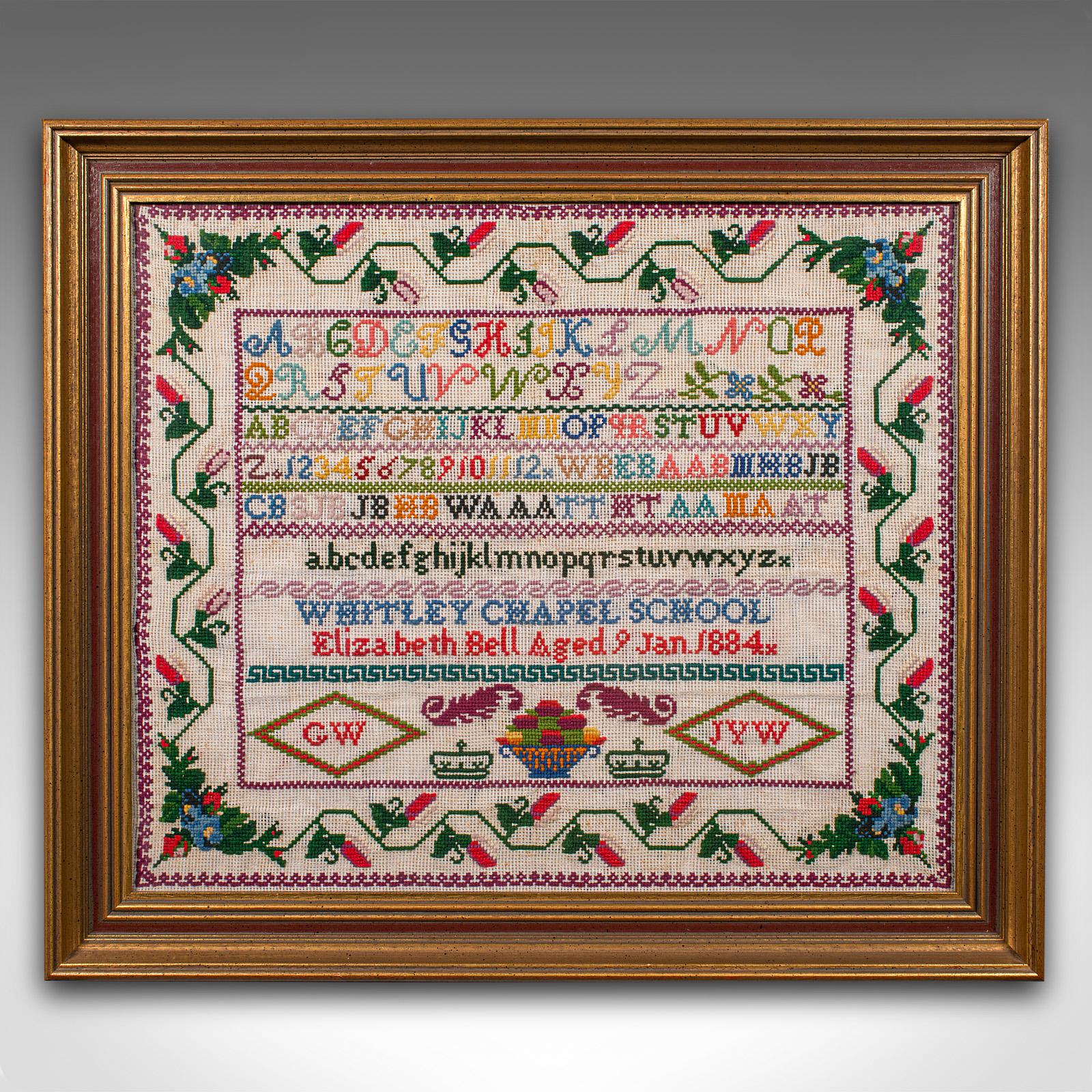 
This is an antique school sampler. An English, needlepoint pupil's embroidery display, dating to the Victorian period, circa 1884.

Charming sampler, showing a deft hand from the 9 year old pupil
Displays a desirable aged patina within a later,