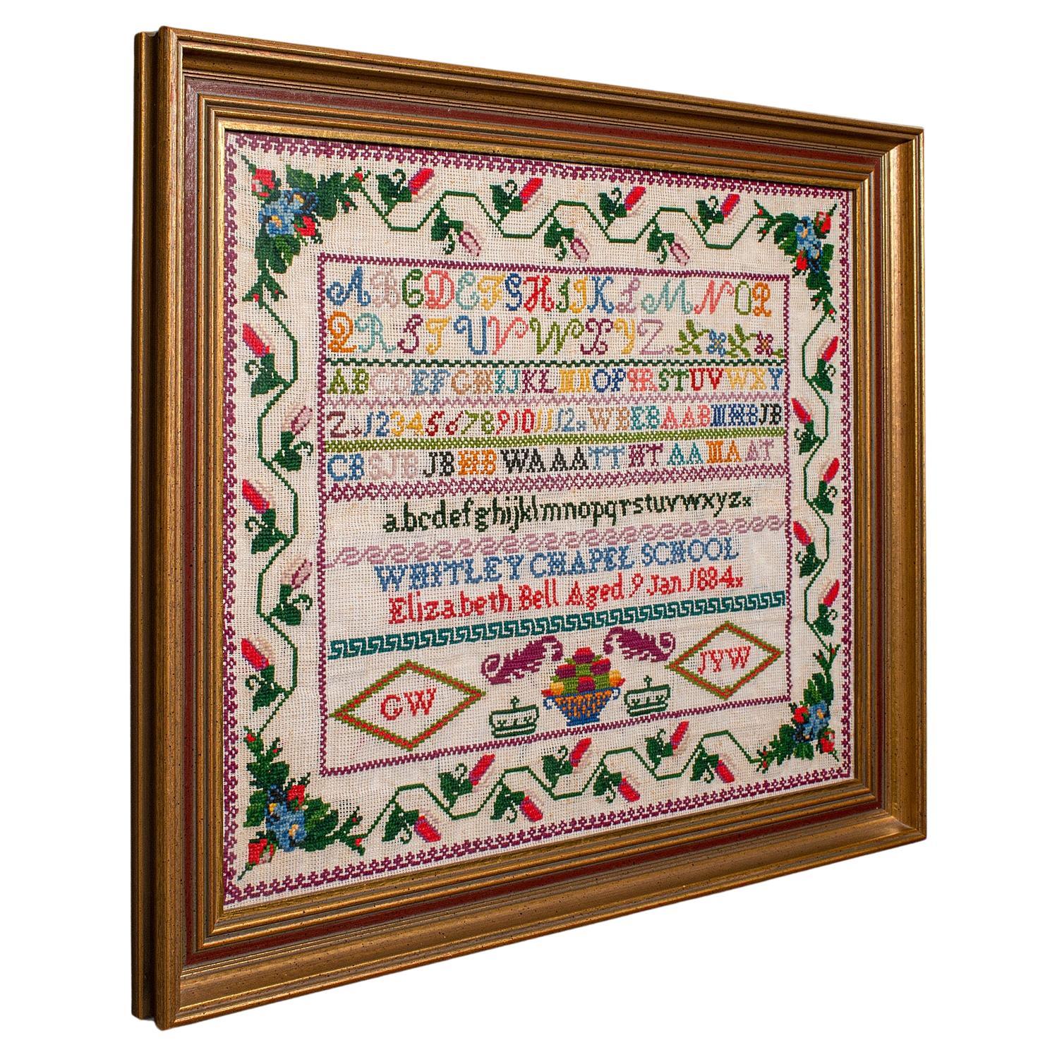 Antiguo muestrario escolar, inglés, bordado a la aguja, victoriano, 1884