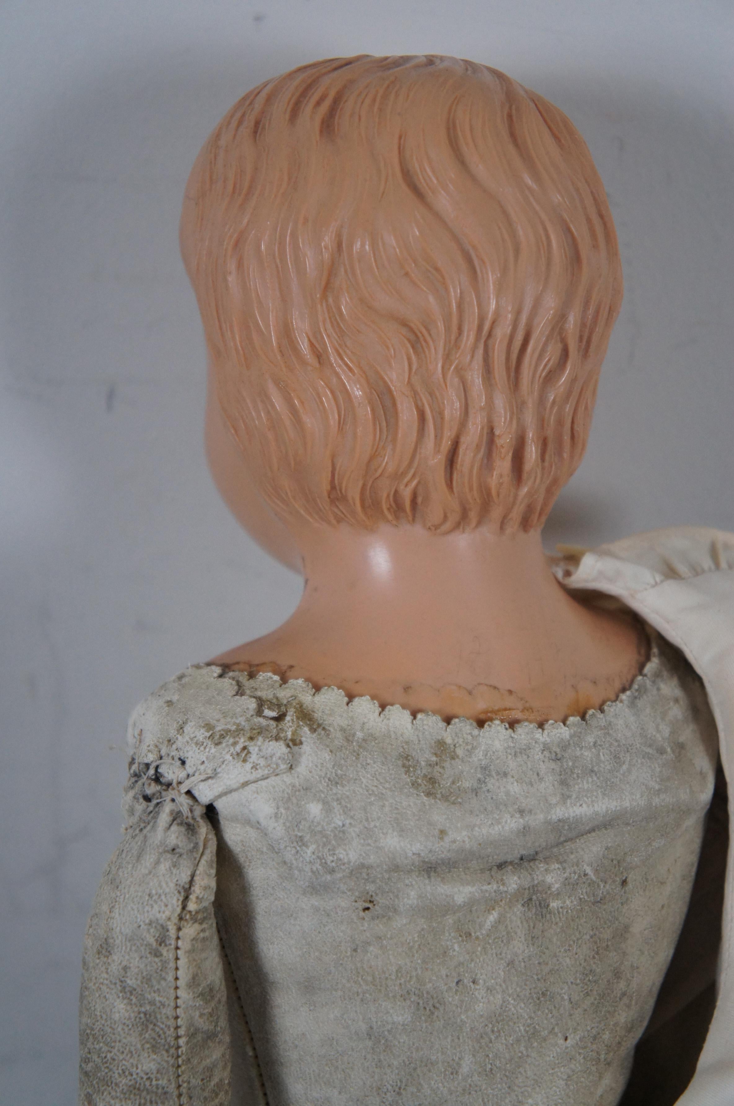 Early 20th Century Antique Schutz-Marke Celluloid Head Leather Body Boy Doll Scotch Bonnet For Sale