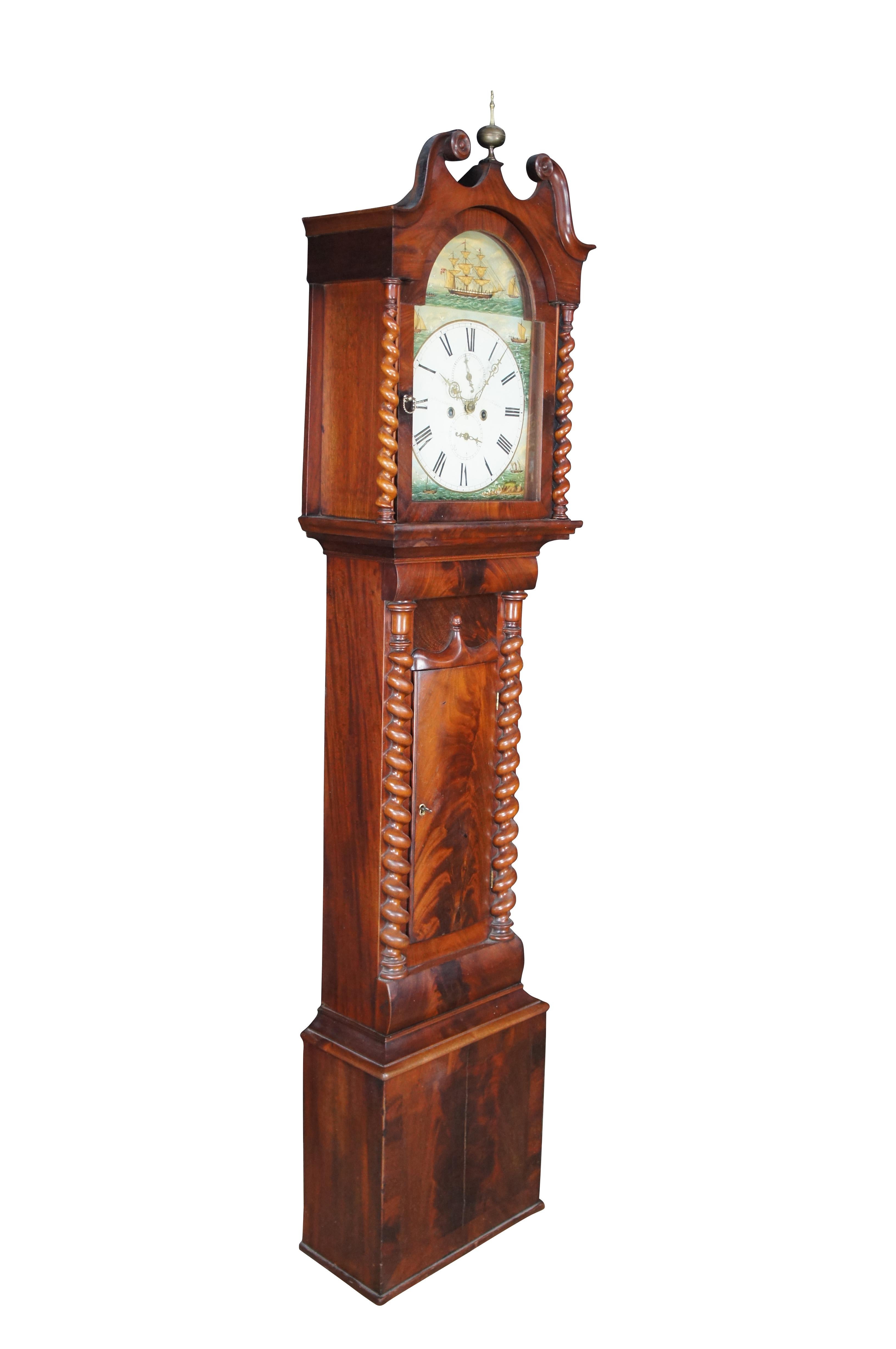 A very impressive antique 19th century Scottish long case 8 day Grandfather clock by George Lumsden of Pittenweem.  Tall Georgian style case featuring barley twisted accents and S scrolled top with open pediment and brass finial.  The face is hand
