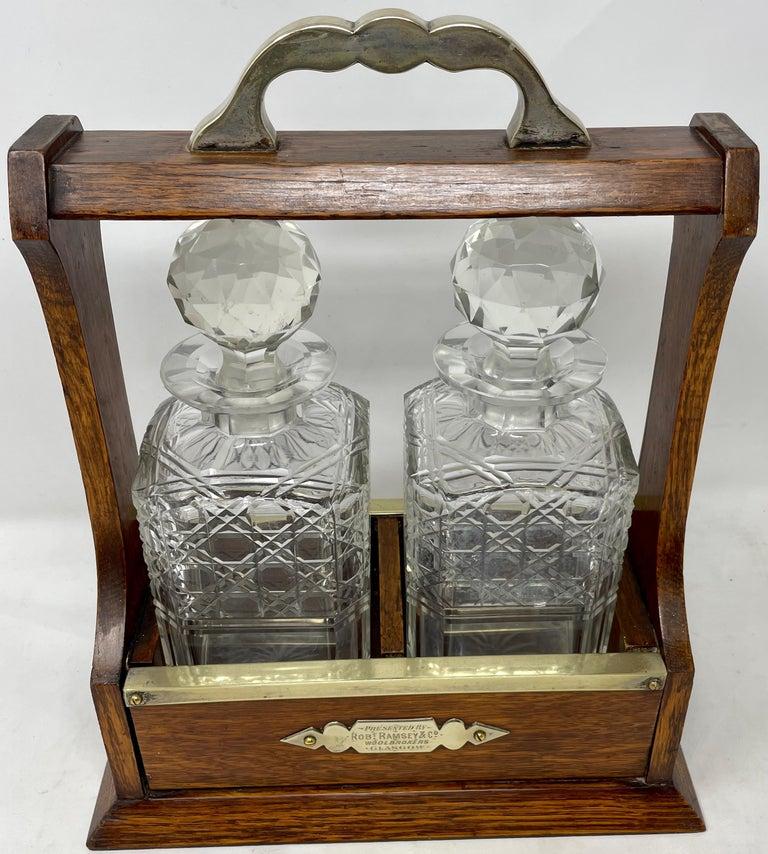 Antique Scottish Golden Oak and Cut Crystal Two-Bottle Tantalus, Circa 1890-1900.