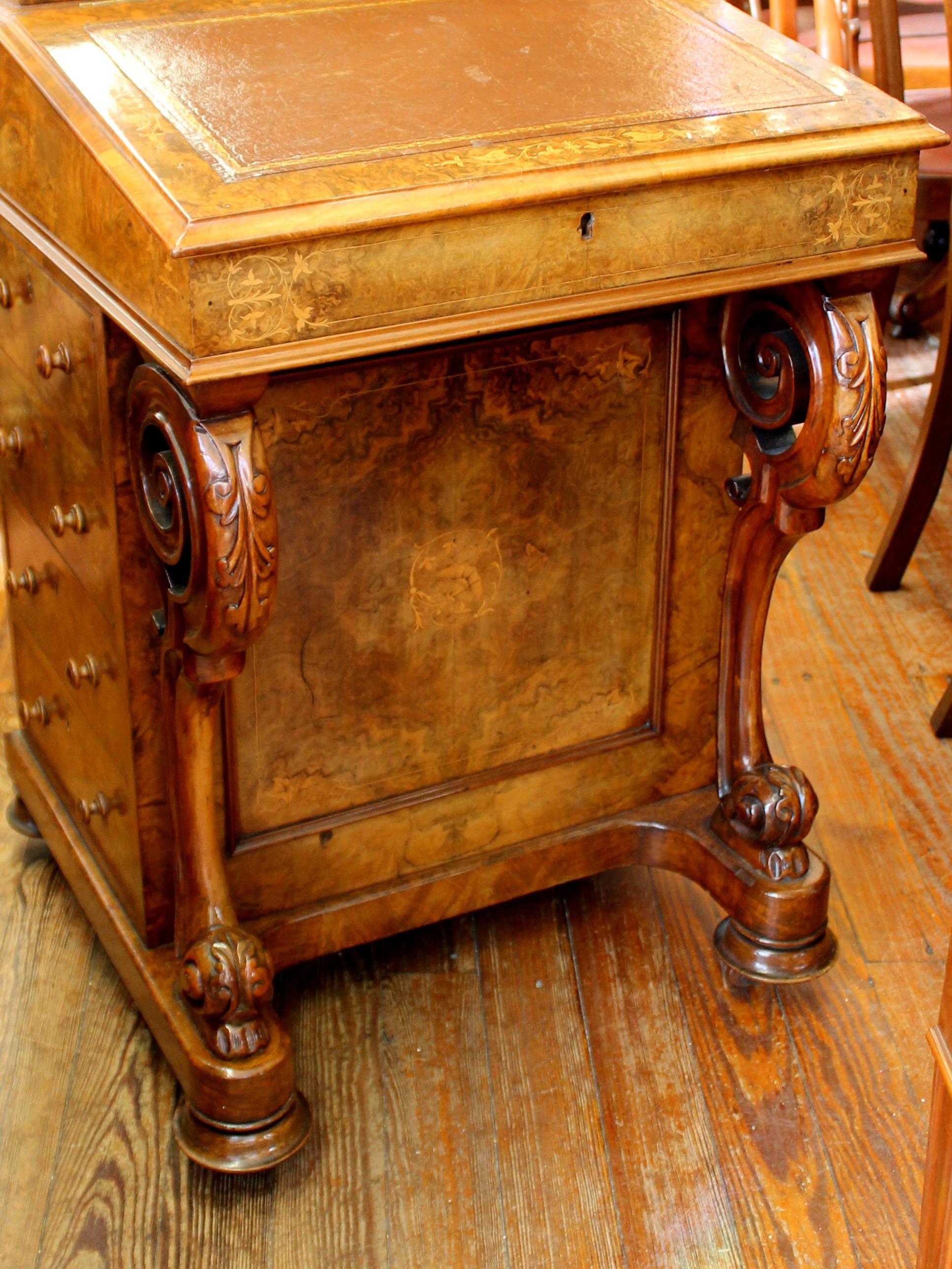 Rare and important antique Scottish exceptional burr walnut davenport or ship captain's desk with fabulous marquetry inlay and satin birch fitted interior; stationery lift-up compartment and retailer's (maker's) label. Handsome old leather.
Bank of