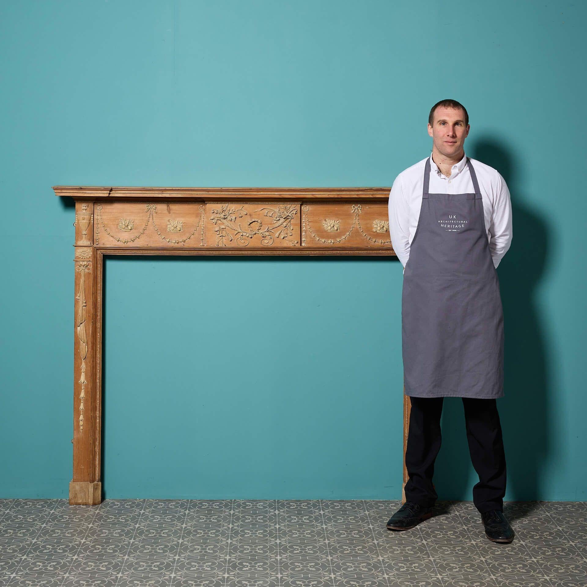 An antique Scottish pine and composition fire surround in the style of Robert Adam.

Dating from the late 18th century, this antique fireplace displays beautiful hand carved elements in boxwood and finer elements in composition (gesso), typical of