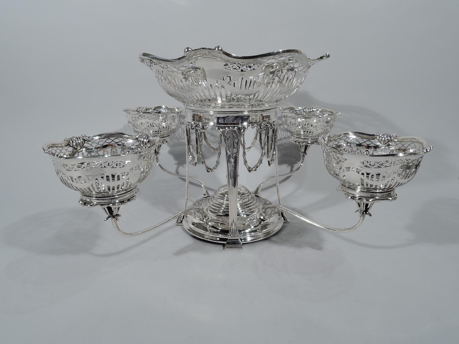 Regency revival sterling silver epergne. Made by Hamilton & Inches in Edinburgh in 1912. Central ring with pendant imbricated leaf garlands, supported by four pilasters terminating in blocks and mounted at base to stepped dome with central vase