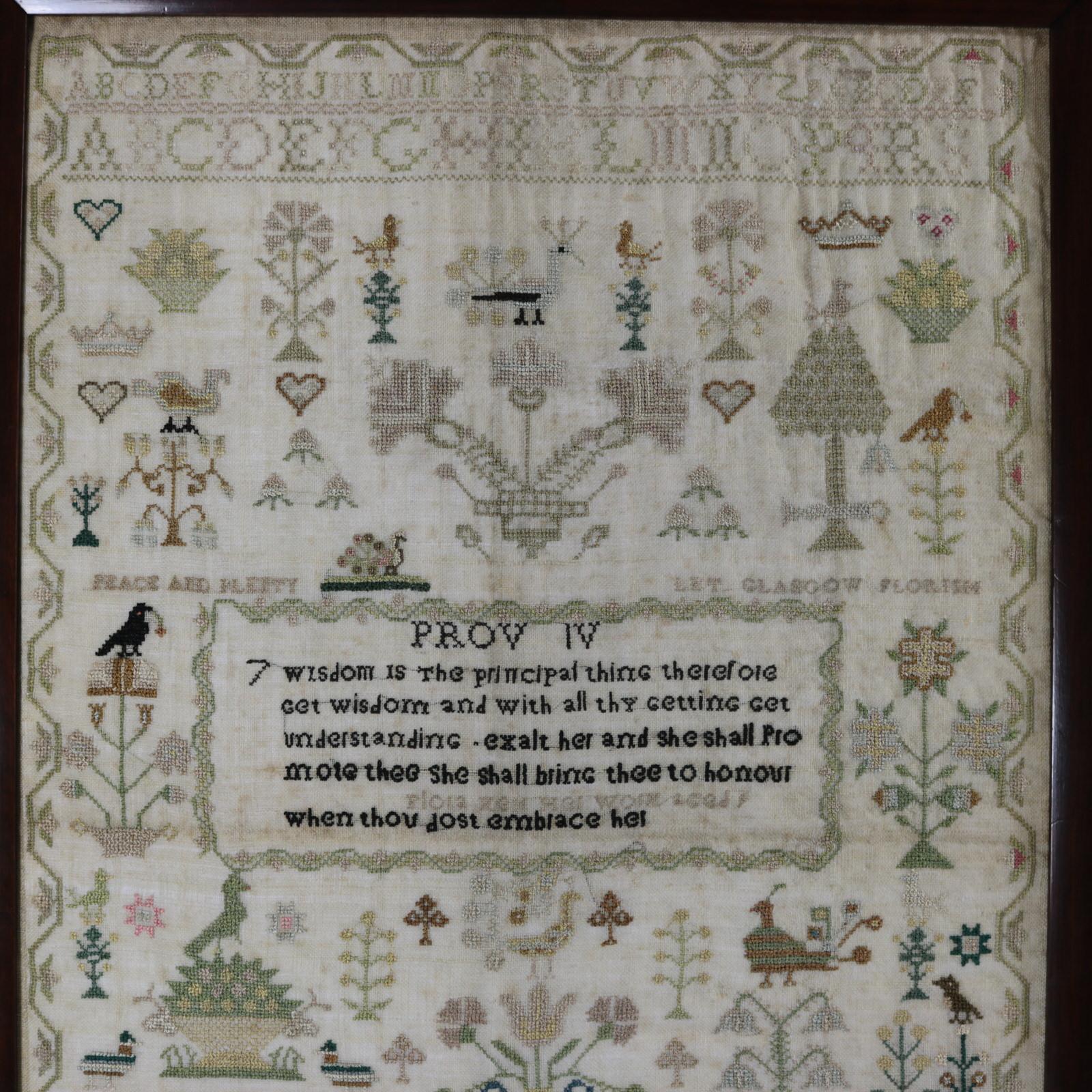 Scottish sampler, 1808, by Flora Kerr, Glasgow. The sampler is worked in silk on linen ground, in cross stitch and Algerian eye. Meandering strawberry border. Colours green, blue, light brown, copper, gold, black and pink. Alphabets A-Z in upper