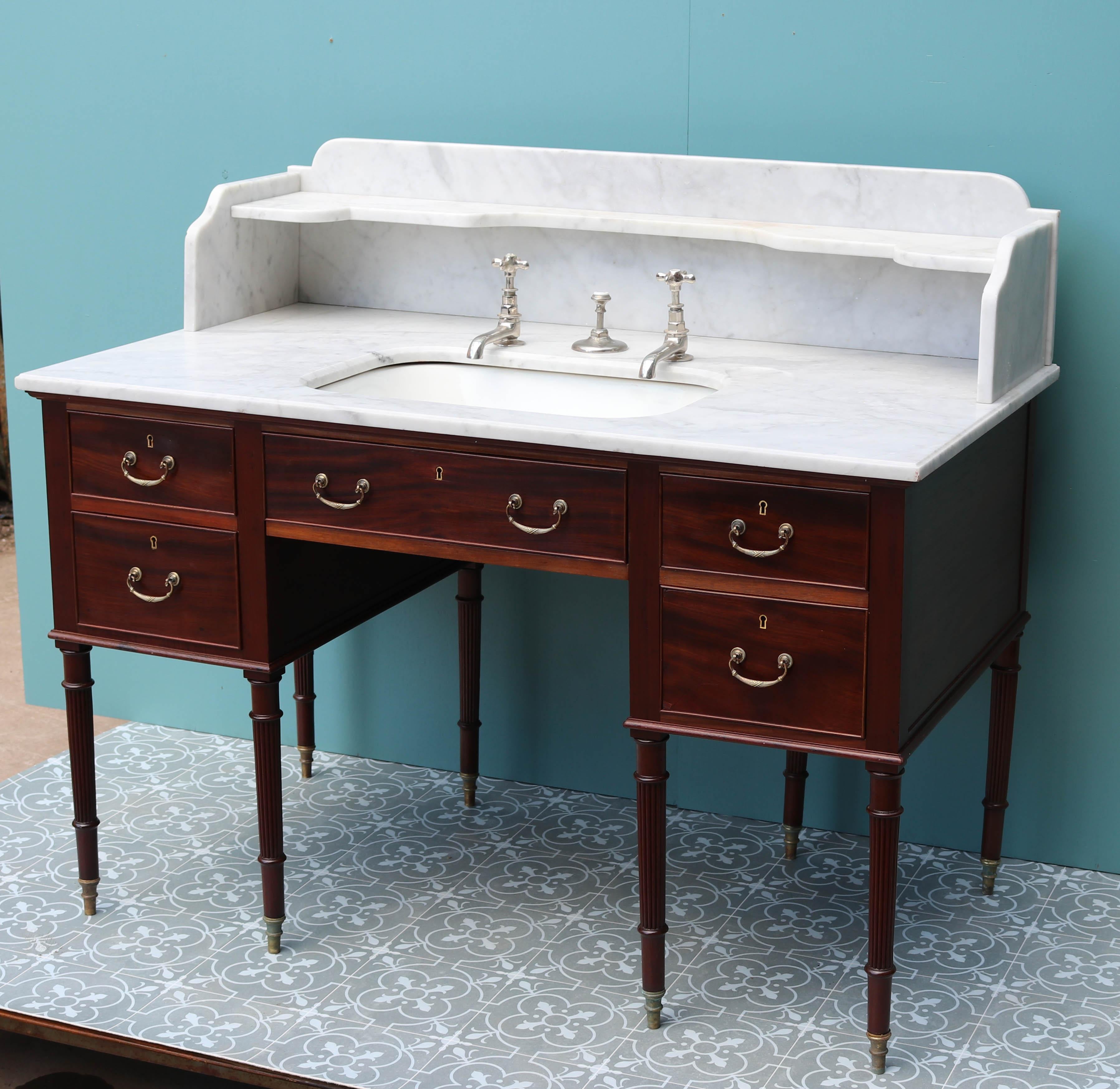 About

A very rare Scottish wash basin with under-mounted porcelain plunger basin and nickel-plated taps. Italian Carrara marble surface and splash-back. Mahogany veneered base standing on eight turned legs.

Individually these wash stands are