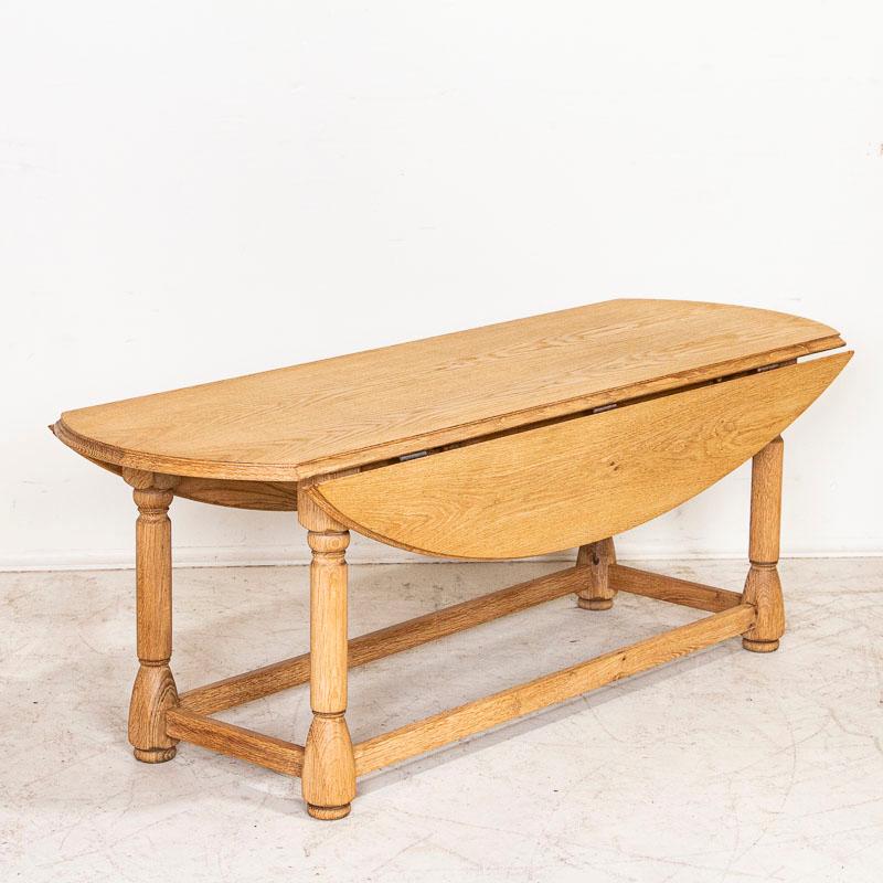 This scrubbed oak coffee exudes a simple French country charm. The oak has been left natural, leaving a simplistic beauty to the wood itself. Unique to this table is the 2 drop leaves; when closed it is merely 20