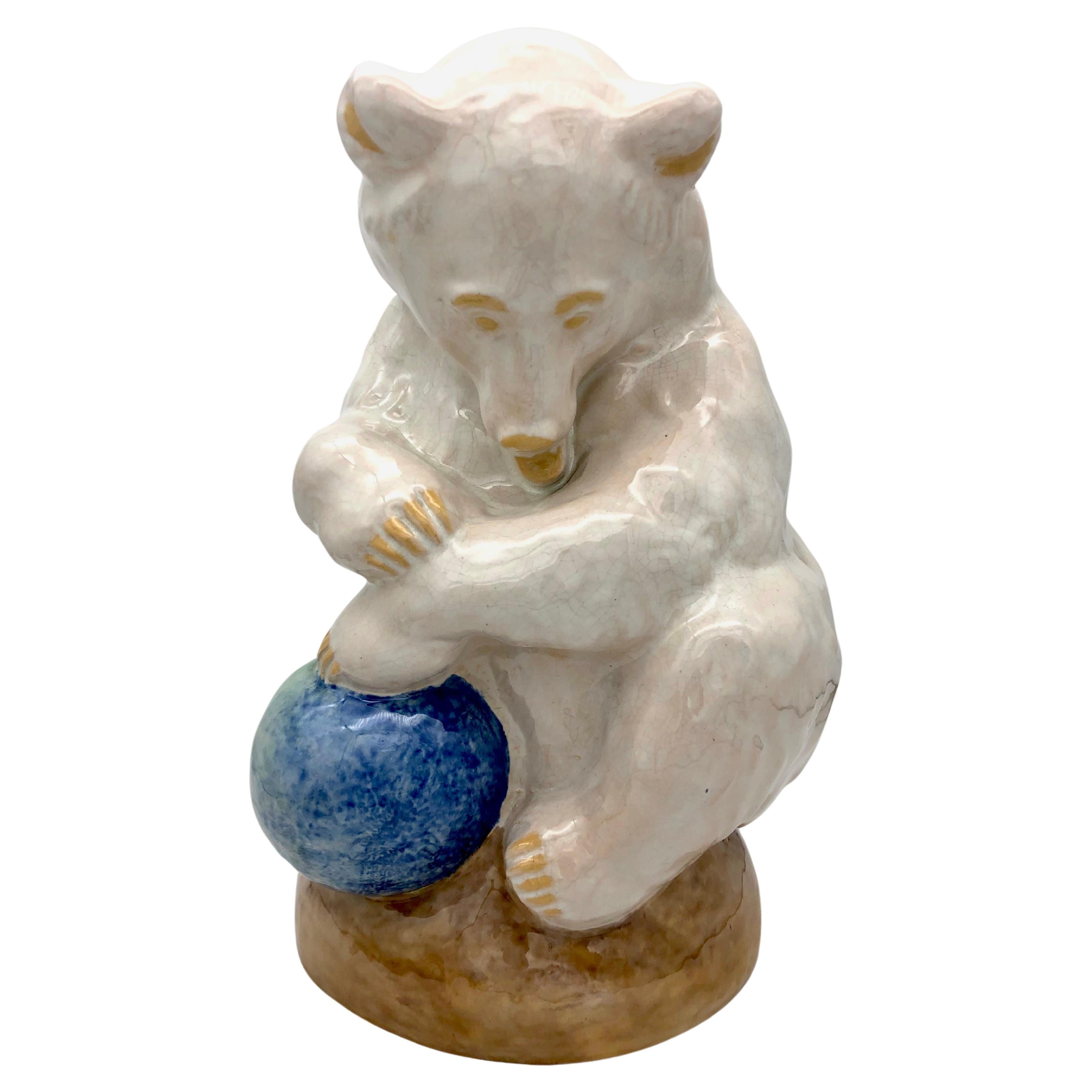 This wonderful sculpture of an ice bear playing with a blue ball is a design by the Austrian Sculptor Franz Barwig (1868 - 1931) dating to 1915-1920. The sculpture was executed by the Wienerberger Keramik company, who executed the works of many