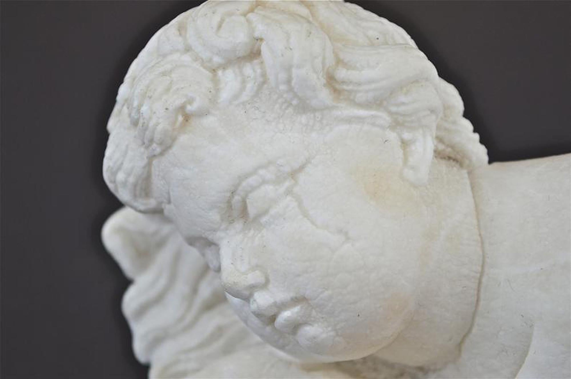 Carved Antique Sculpture of a Sleeping Cherub For Sale