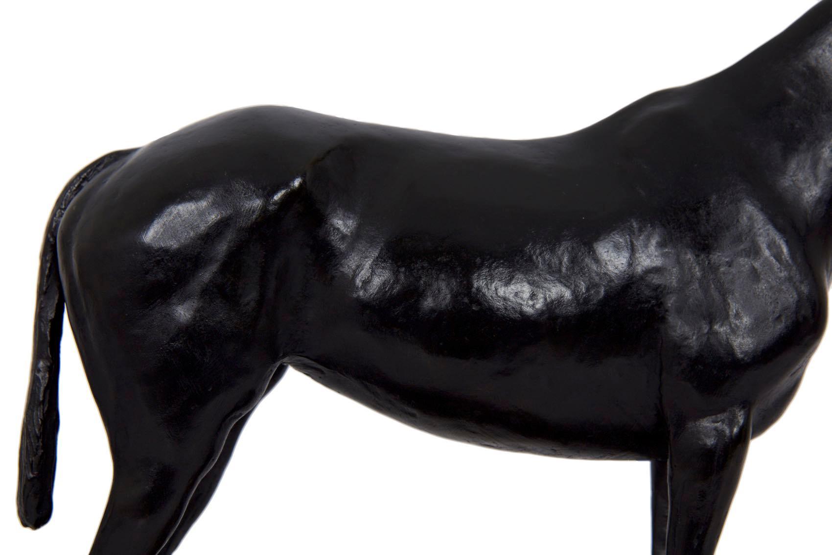 A fine modernist Equestrian study by Mary Stewart La BoyTeaux, the bronze sculpture was executed using the lost-wax method at the Roman Bronze Works foundry in New York and is situated over an original black slate base. The corner of the base is
