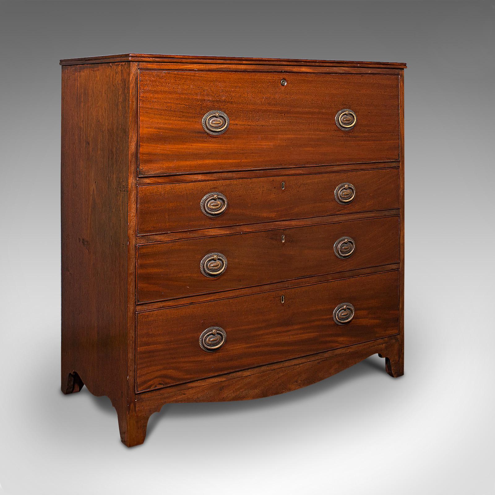 This is an antique secretaire cabinet. An English, mahogany chest of drawers with drop front writing desk, dating to the Georgian period, circa 1800.

Gracefully concealed writing desk fit for a gentleman's bedroom, writer's study or morning